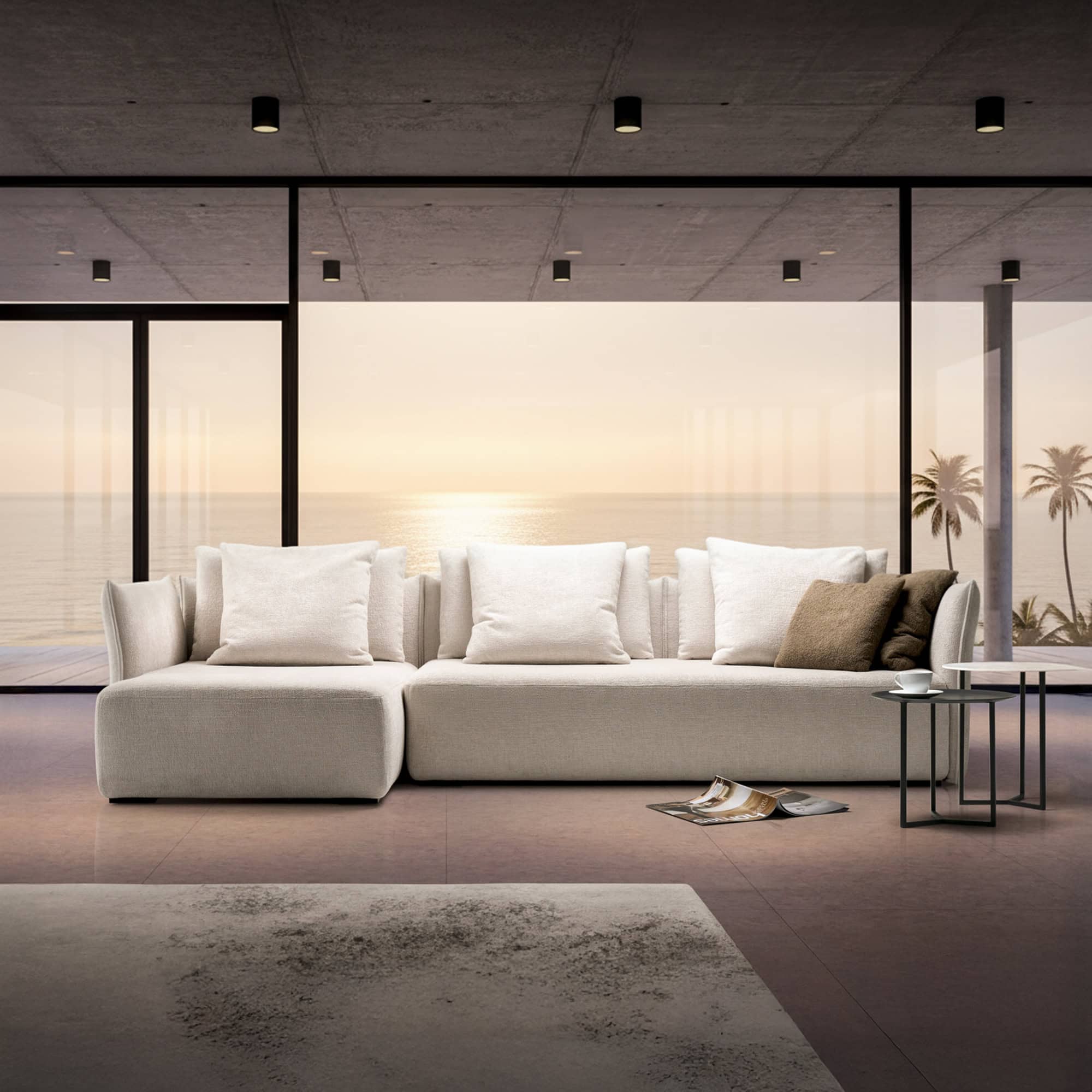 Le Savoie Modular Upholstered Sofa in a modern interior with mountain views, styled in light neutral fabric with oversized back cushions.