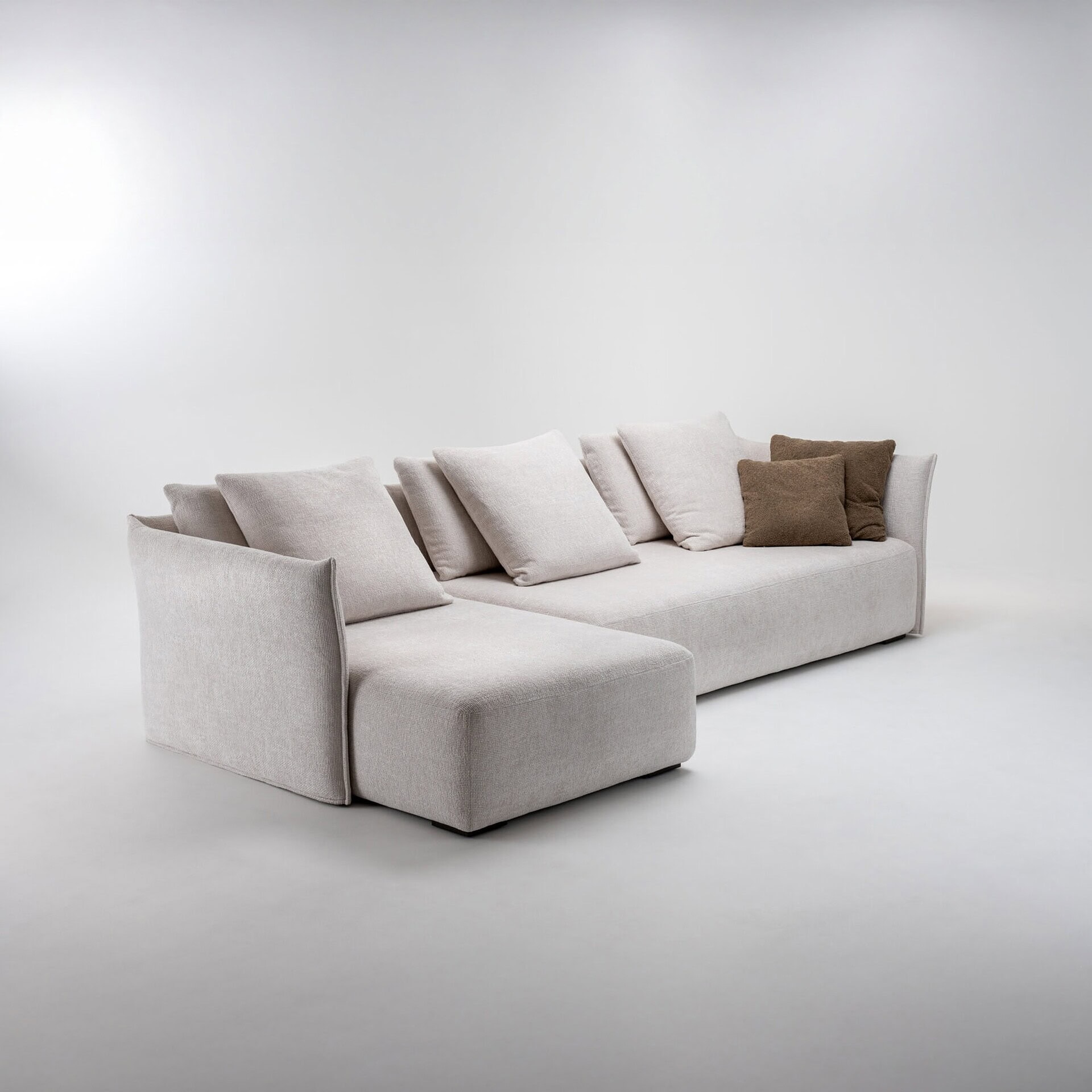 Elegant beige sectional sofa with multiple throw pillows for modern living spaces.