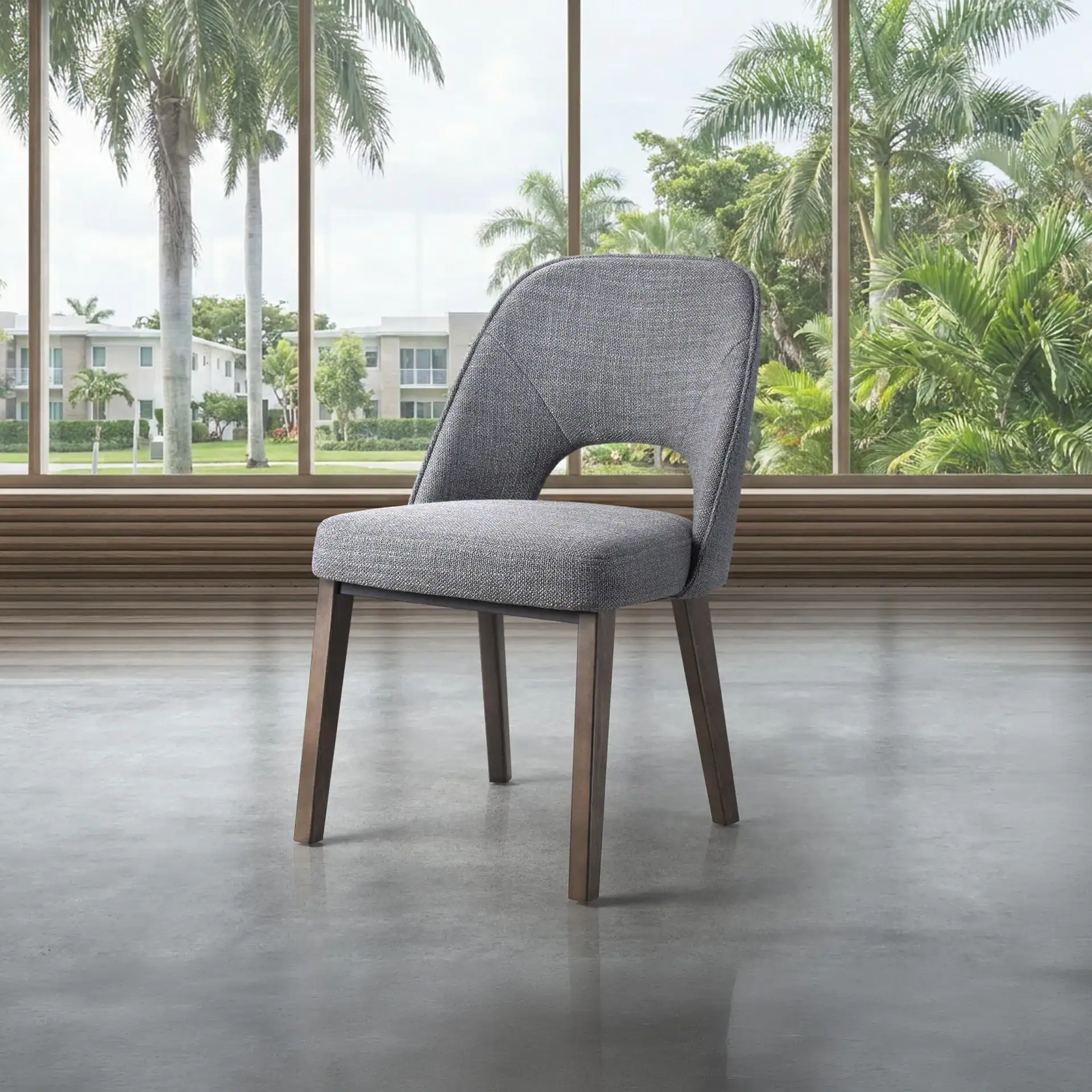 Upholstered dining chair with modern design and comfortable gray fabric. Perfect for contemporary di.