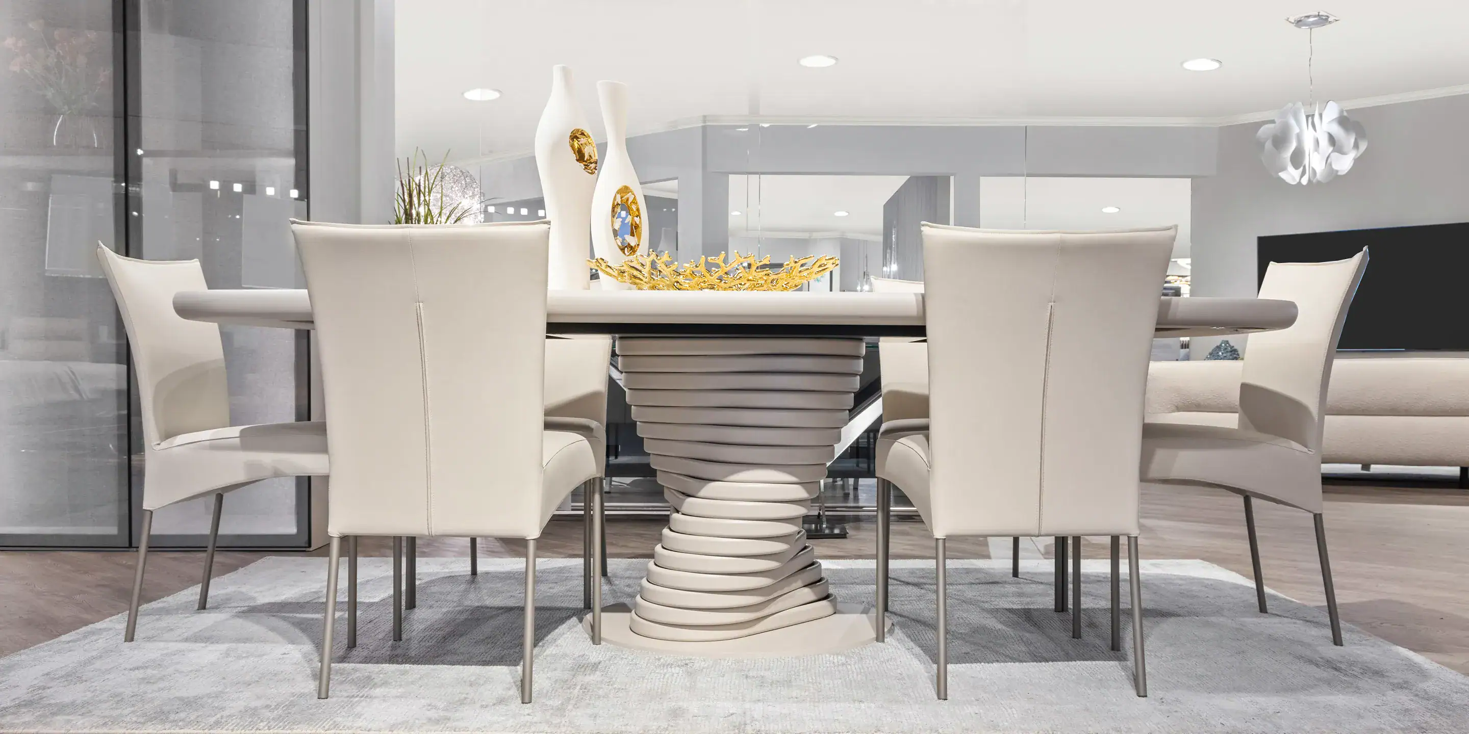 Elegant white dining table with modern design, perfect for contemporary interiors.