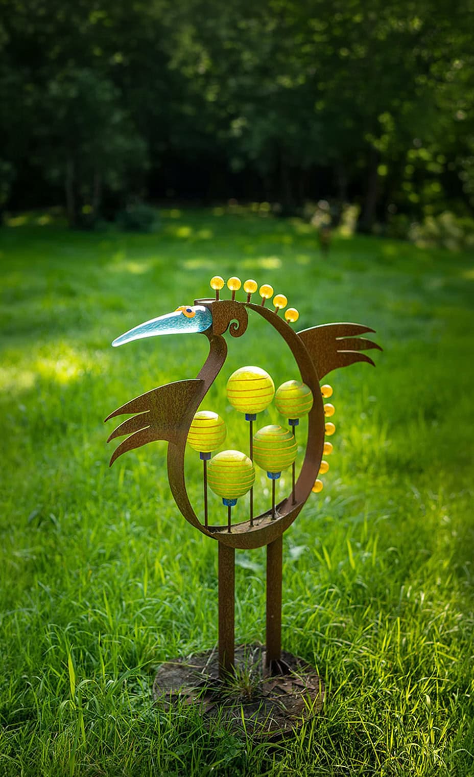 Metal bird sculpture with colorful accents for garden or patio decoration.