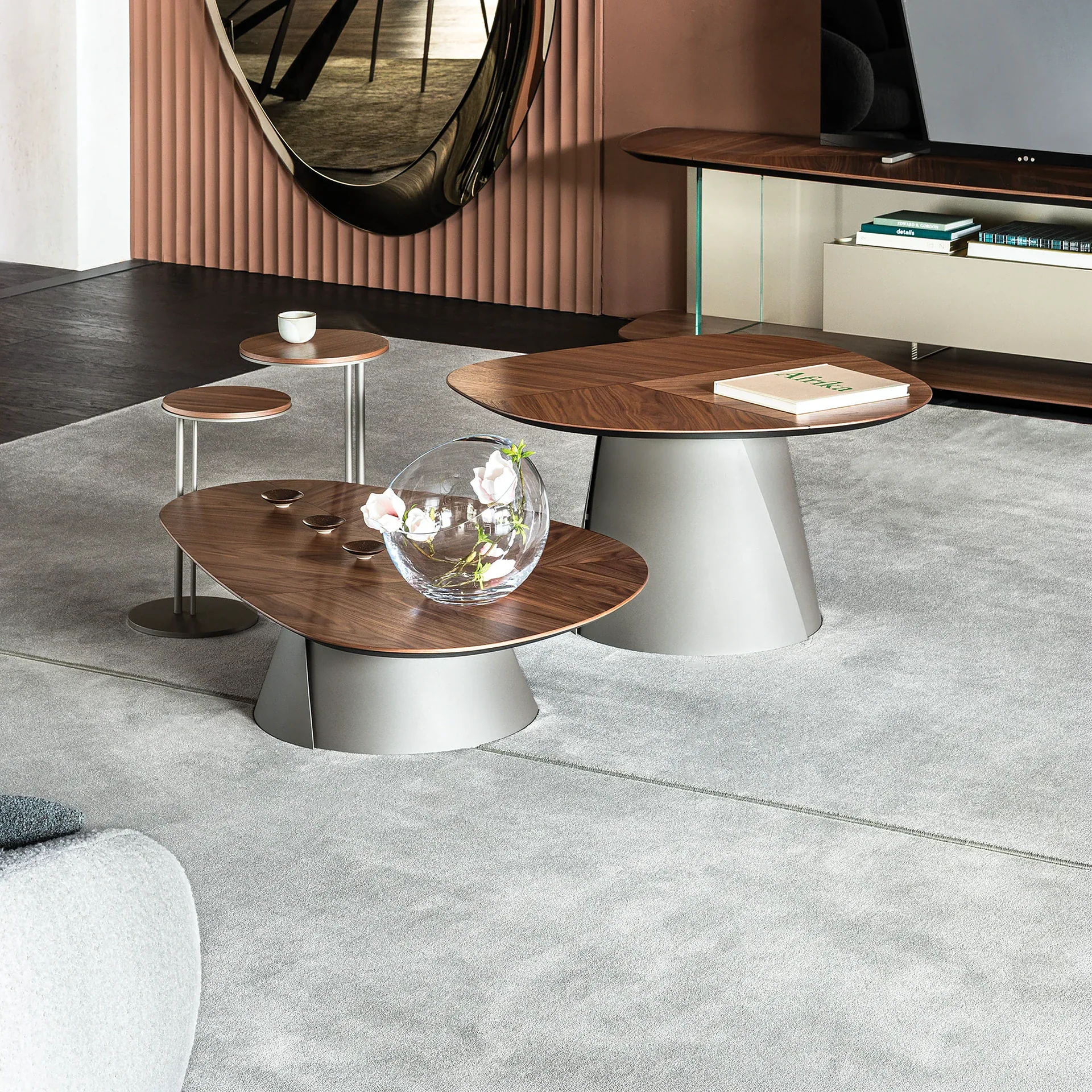 Sklar Furnishings coffee tables in a living room with wooden tops and gray bases.