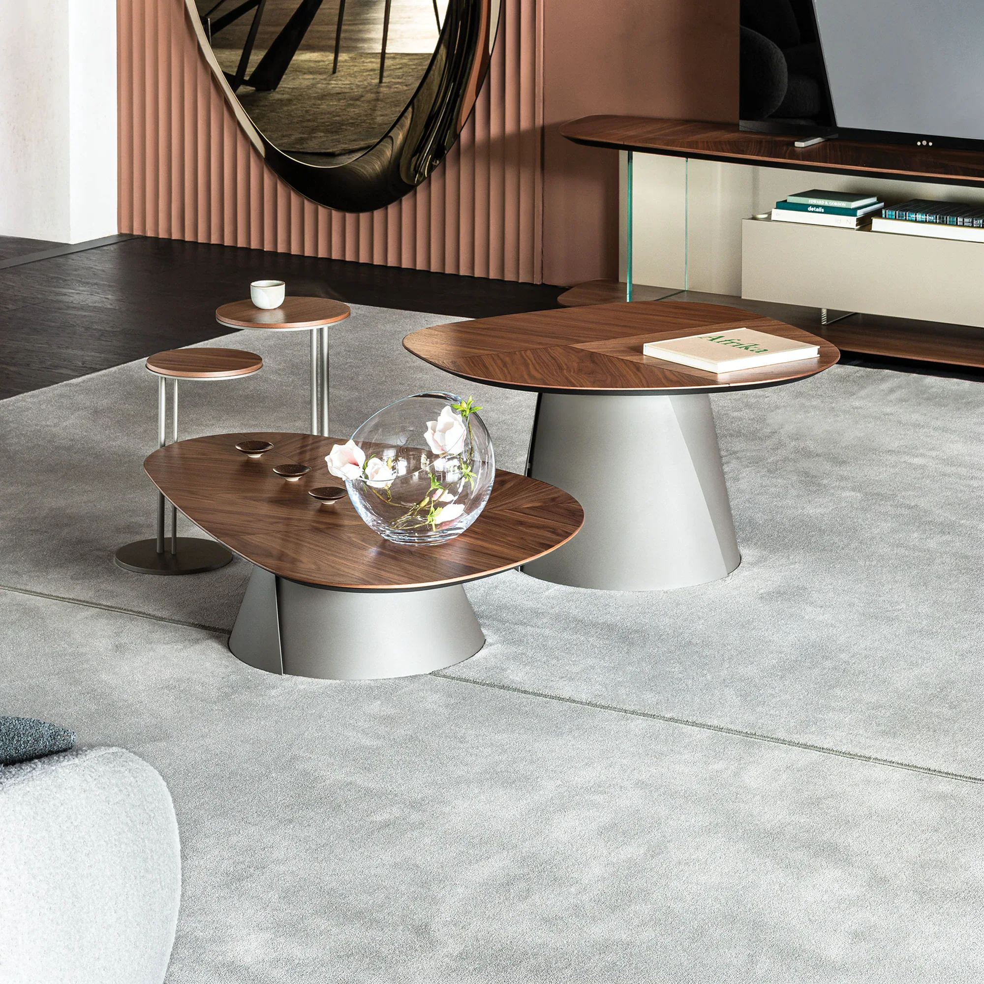 Sklar Furnishings coffee tables in a living room with wooden tops and gray bases.