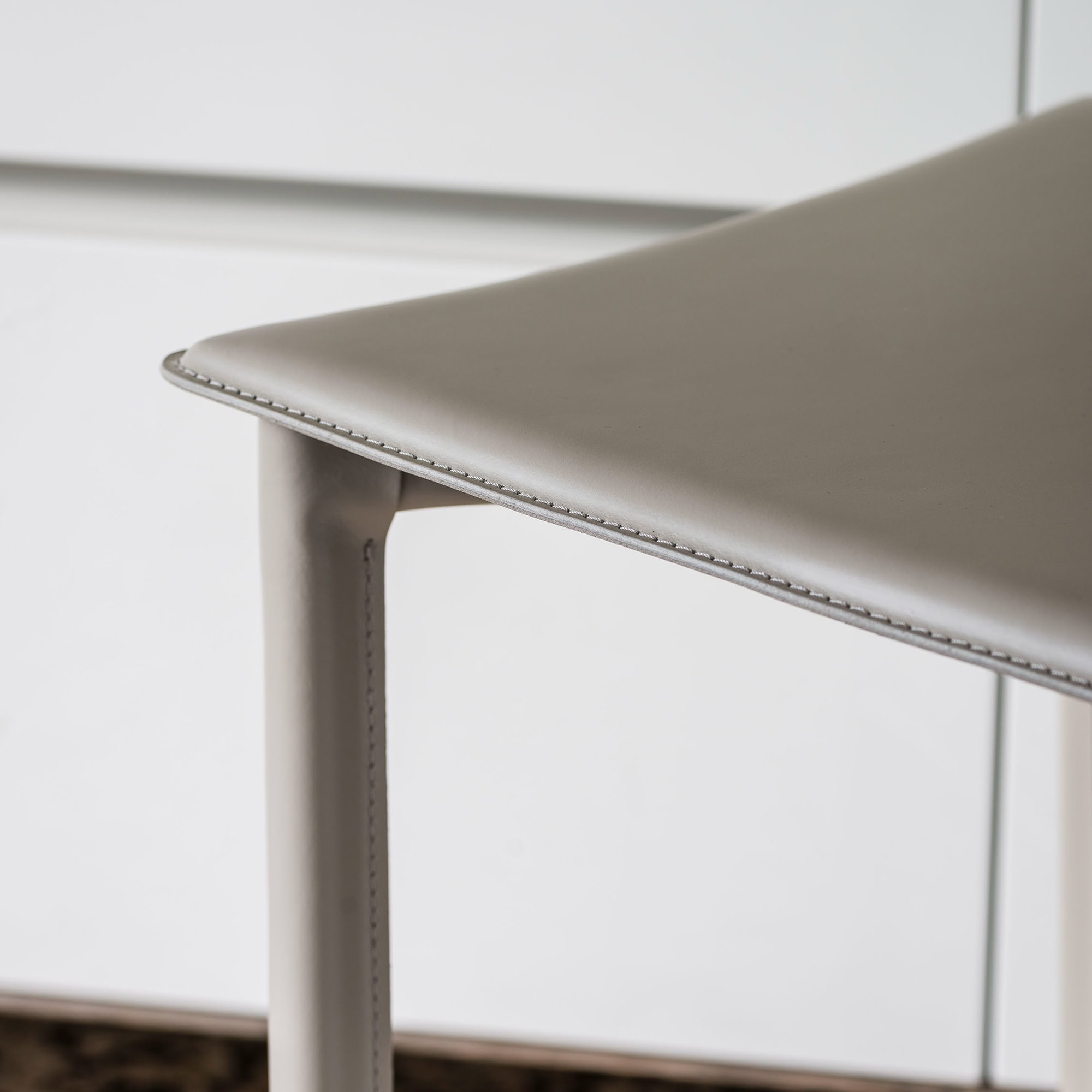Close-up detail of the Cliff Stool seat and stitching, highlighting craftsmanship and materials.