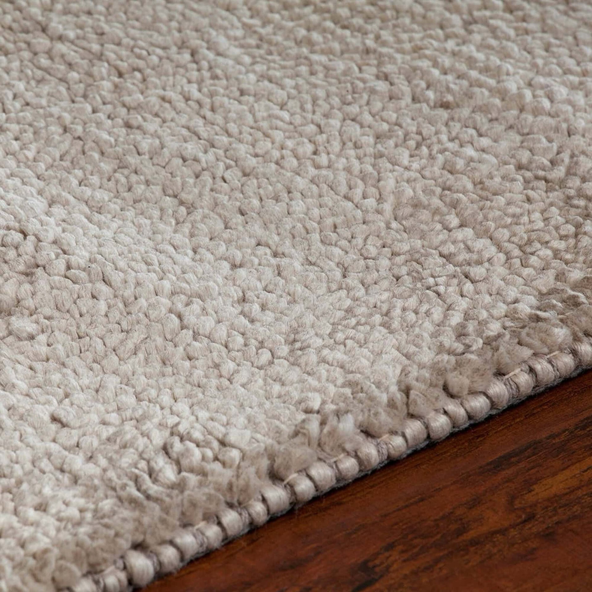 Mae 39000 Area Rug corner close-up showing texture and weave