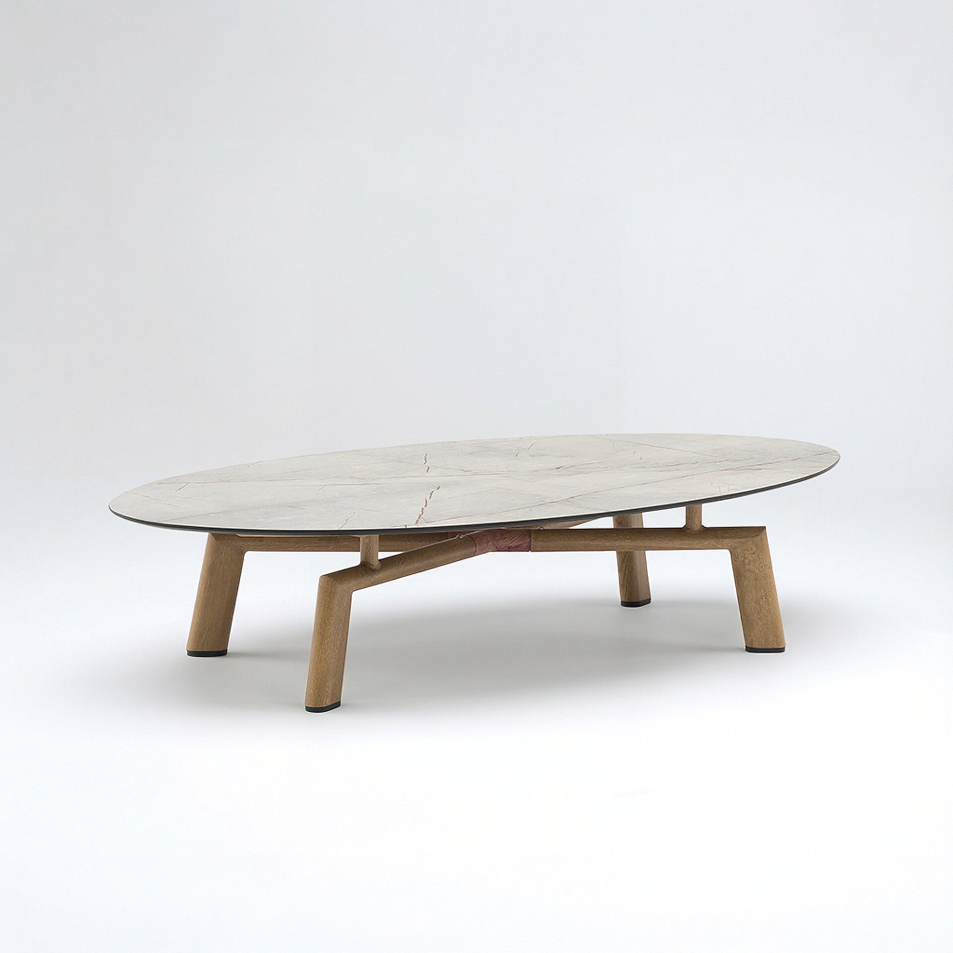 Lounge Oval Coffee Table with wood-look aluminum base and oval stone-look top, shown on a white background.