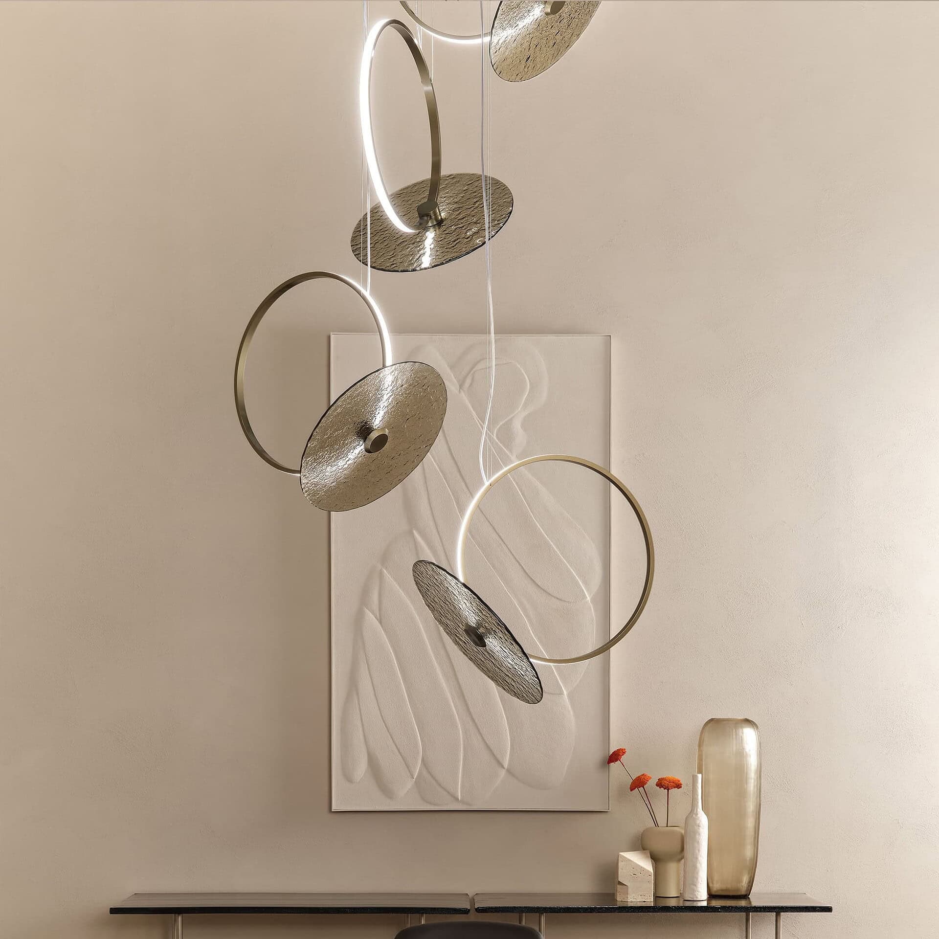 Marry Me Glass Pendant Light with sculptural rings, shown in a minimal interior.