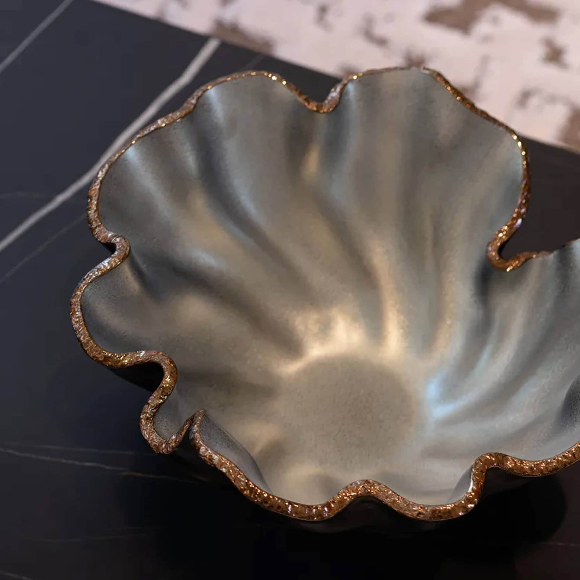 Close-up of Bowl Lirio Glass Centerpiece showing organic glass texture with gold and mica highlights.