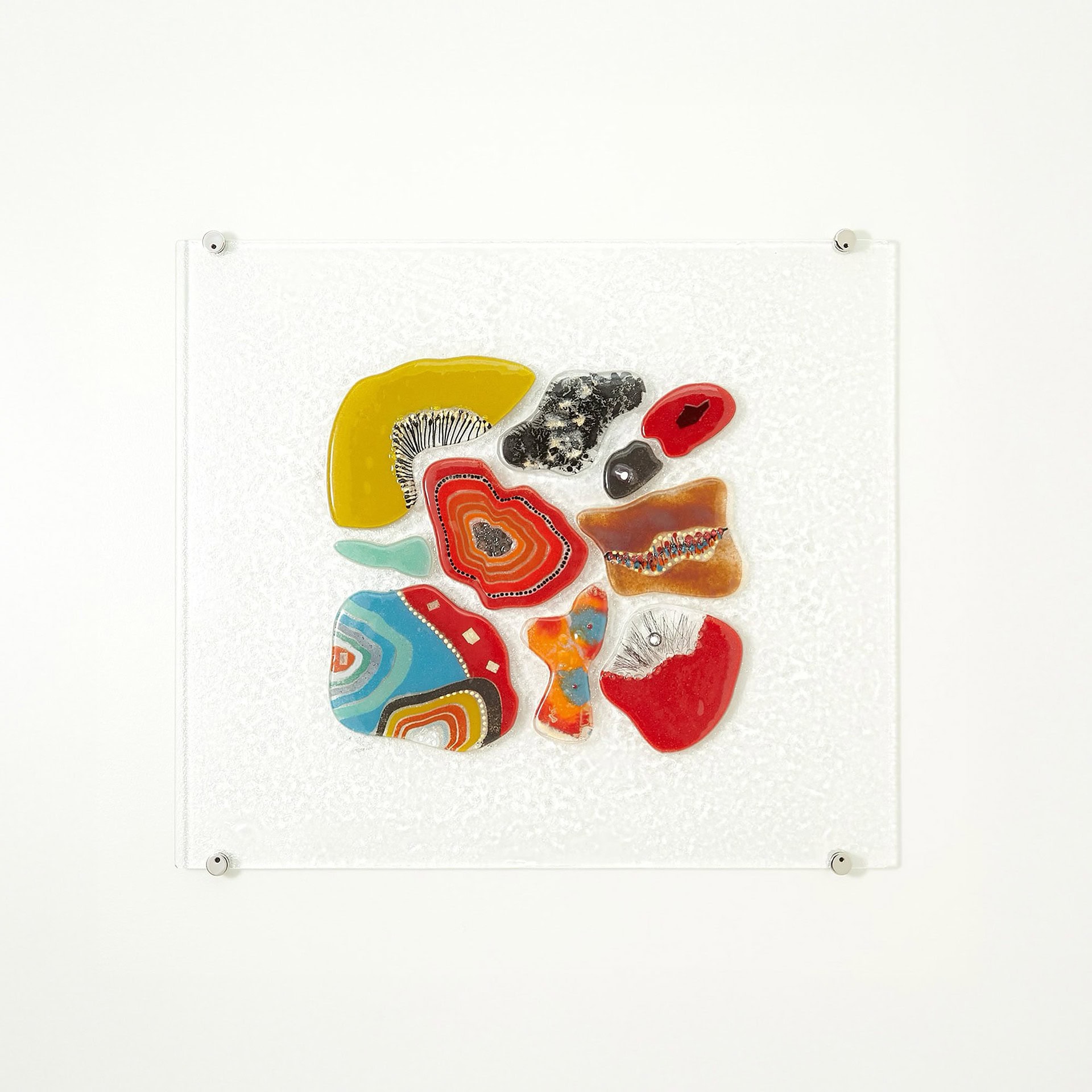 Fused Glass Wall Panel featuring red and turquoise glass accents.