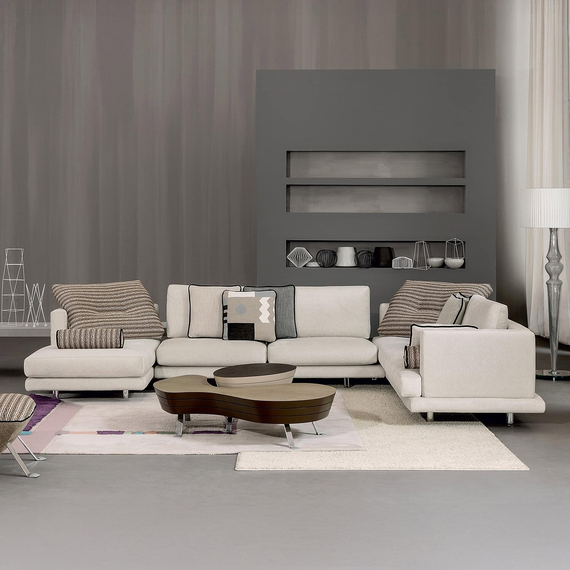 Contemporary living room with modern sofa, stylish coffee table, and designer decor accents.