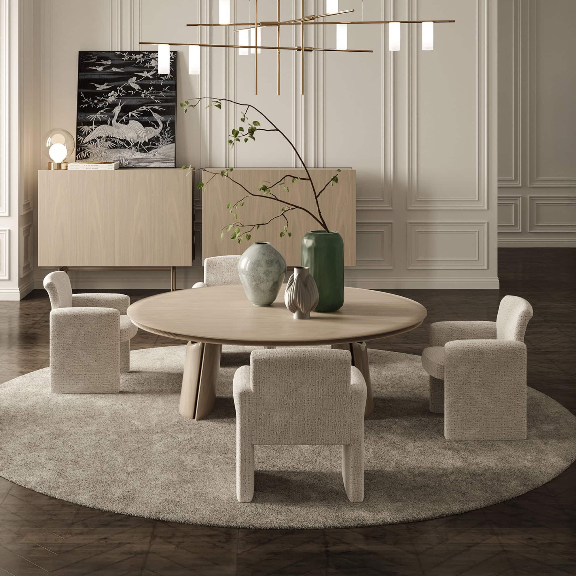 Quentin Dining Chair styled in a modern dining room with round table.