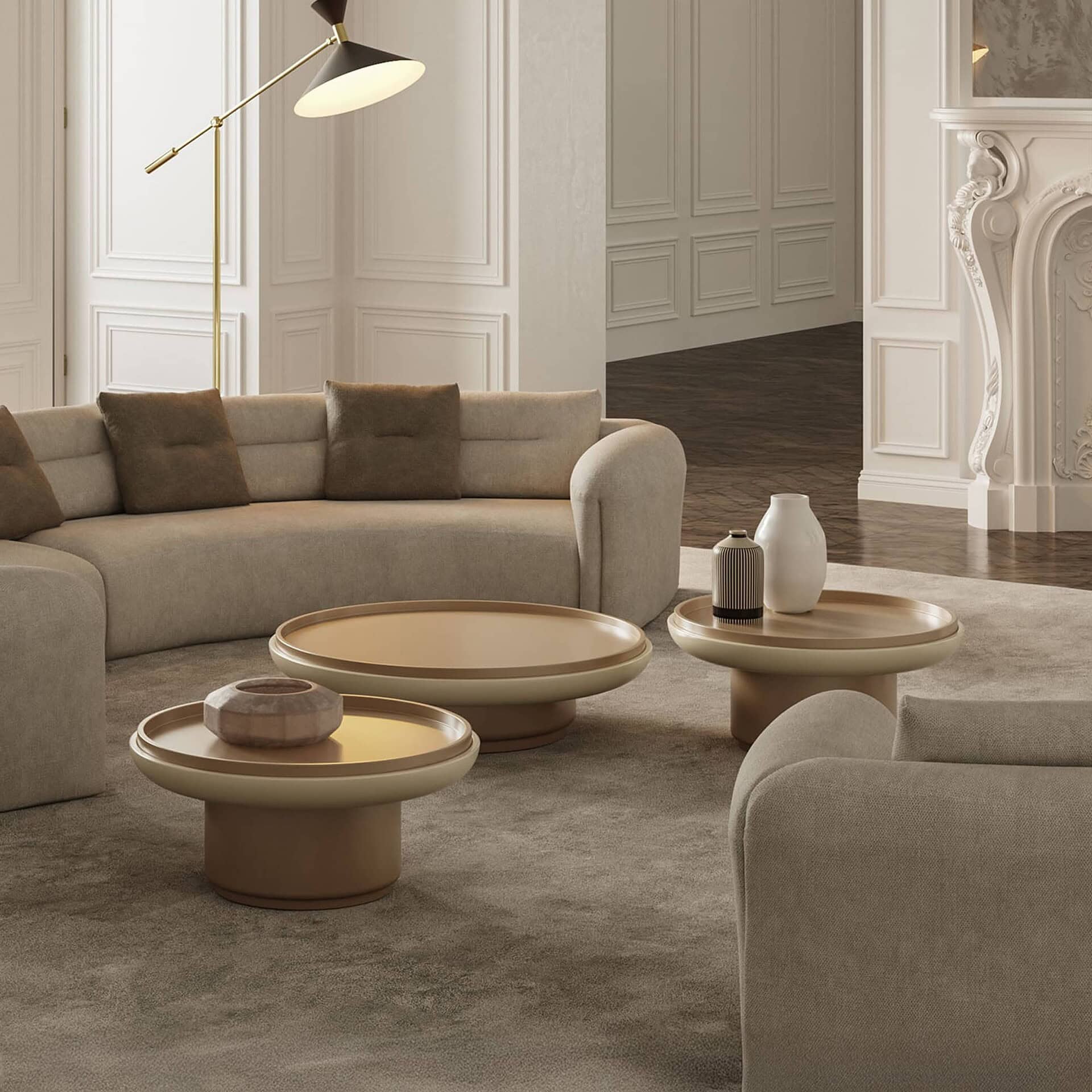 Contemporary living room with beige sectional sofa and modern coffee tables, elegant wall paneling.