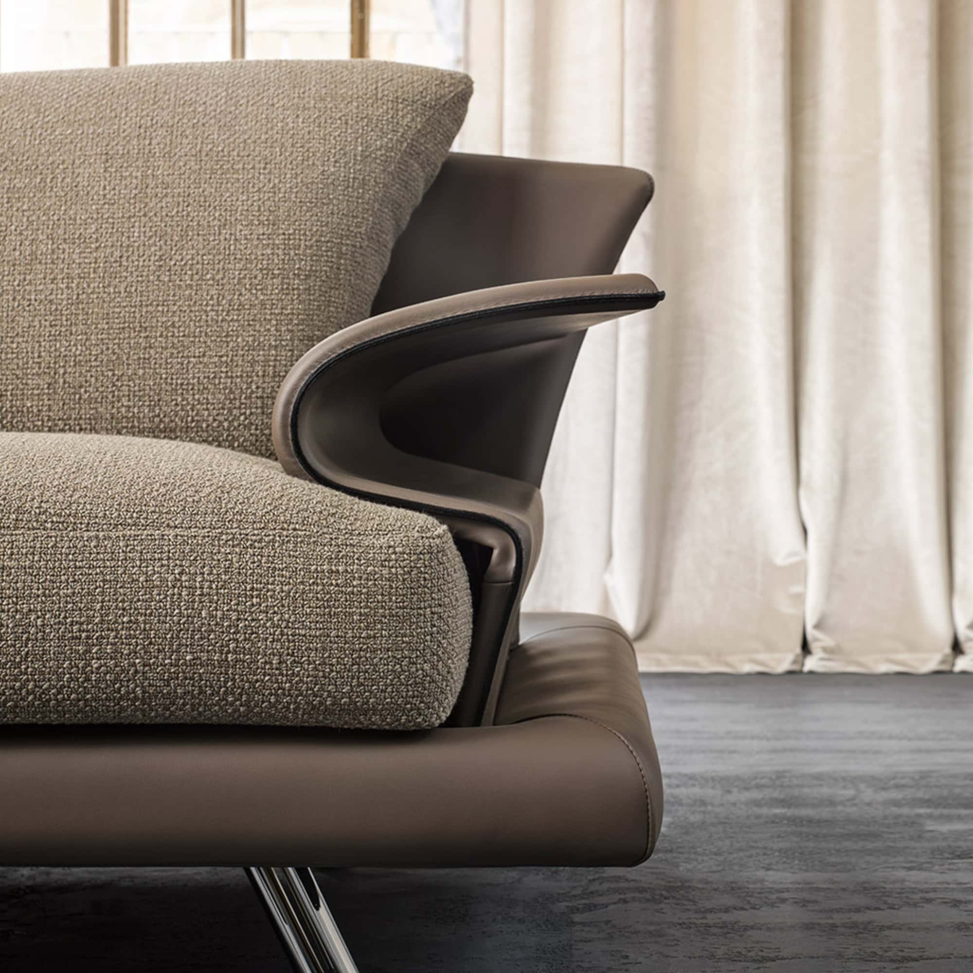 Contemporary leather and fabric lounge chairs with sleek metal legs for modern interior design.