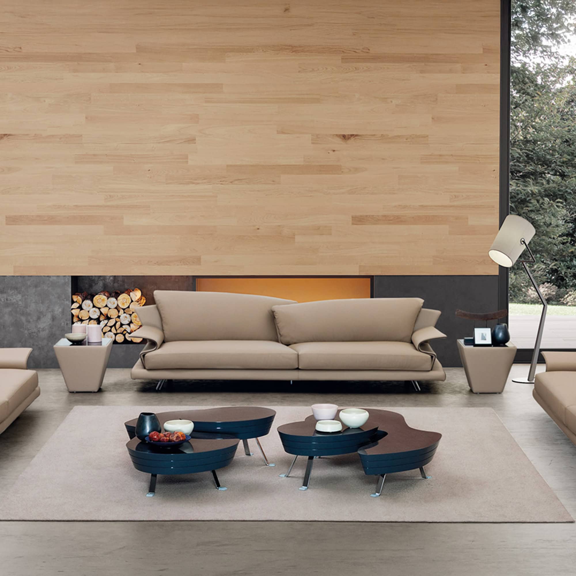 Modern beige sofa in contemporary living room with coffee tables and floor lamp suitable for stylish home decor.