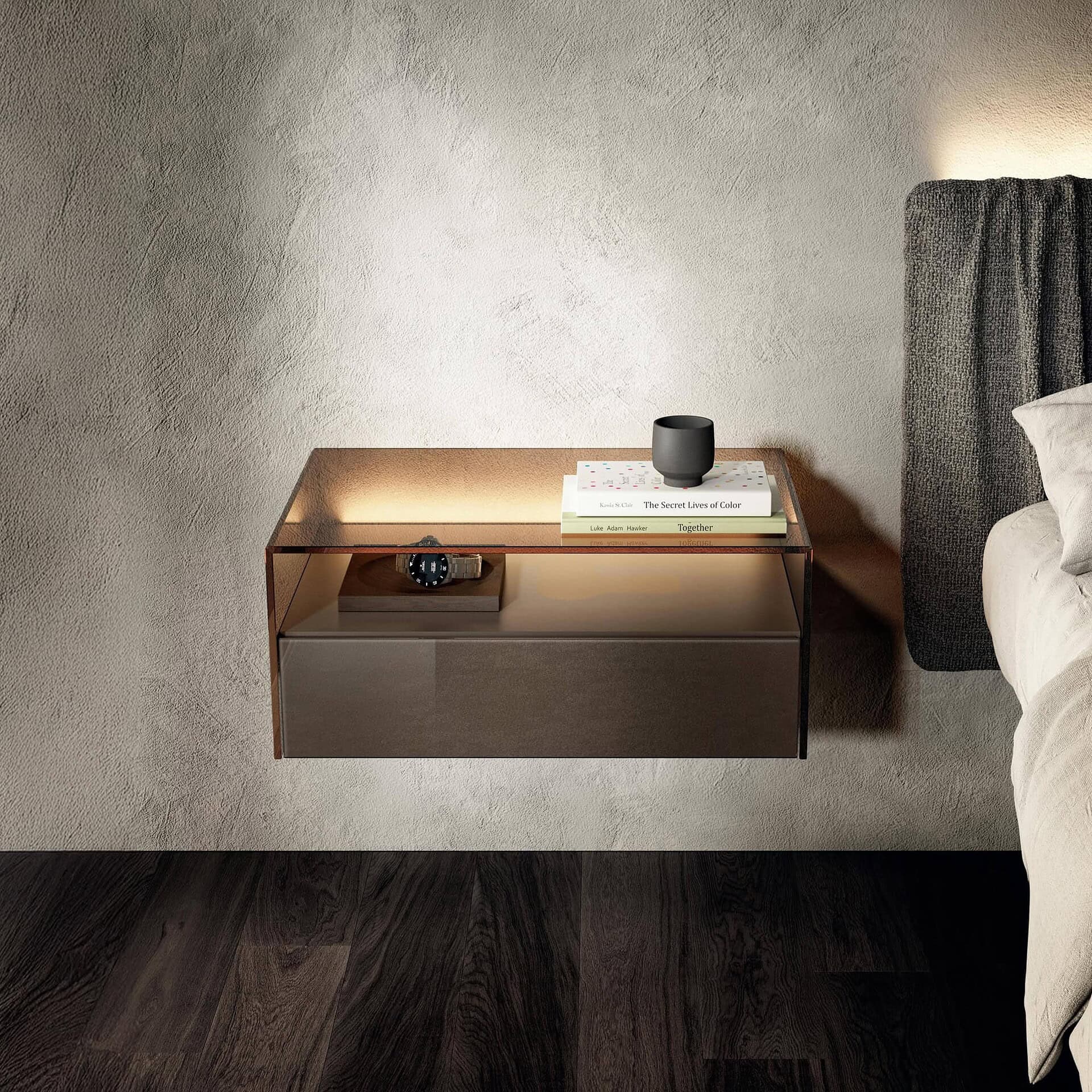 Sleek modern wall-mounted nightstand with glass top and drawer, ideal for contemporary bedroom decor.