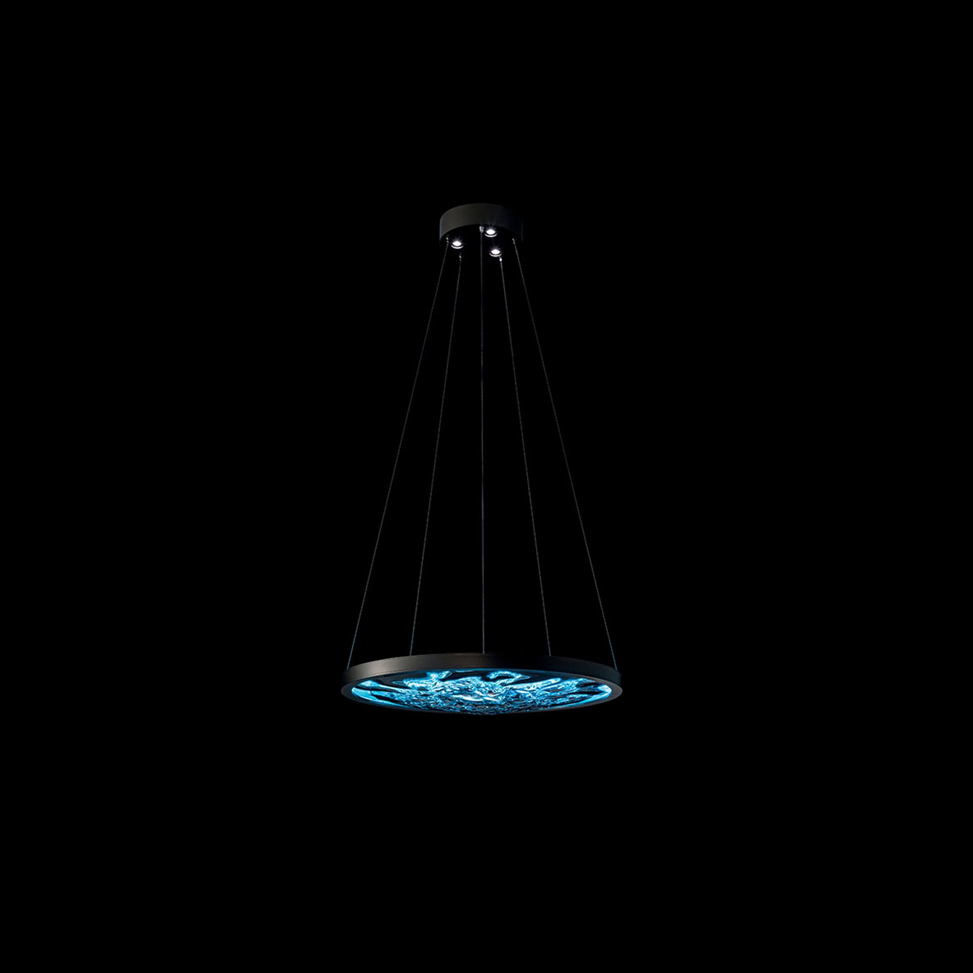 Acqua Murano Glass Pendant Light glowing in a dark setting with soft illumination