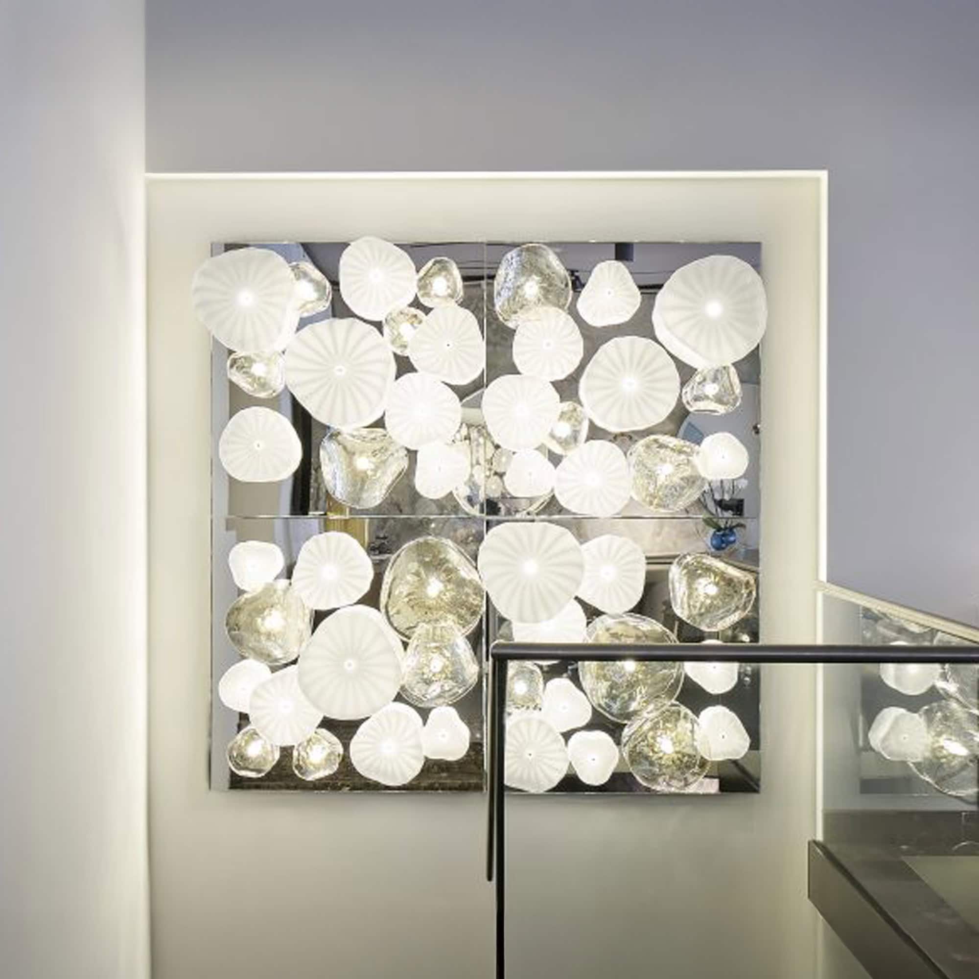 Ninfee Decorative Lighting Module installed on a wall with glowing LED backlighting.