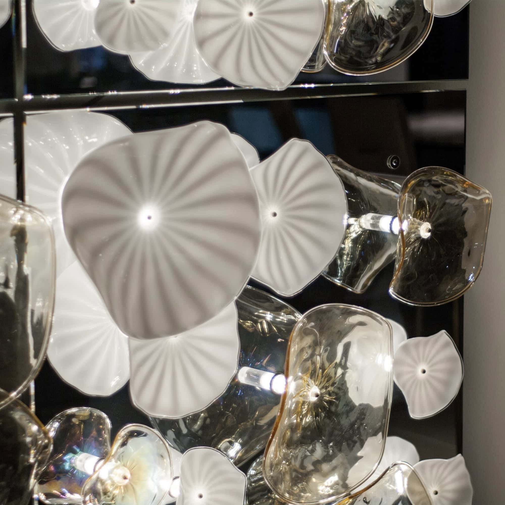 Close-up detail of Murano glass flower elements on the Ninfee Decorative Lighting Module.