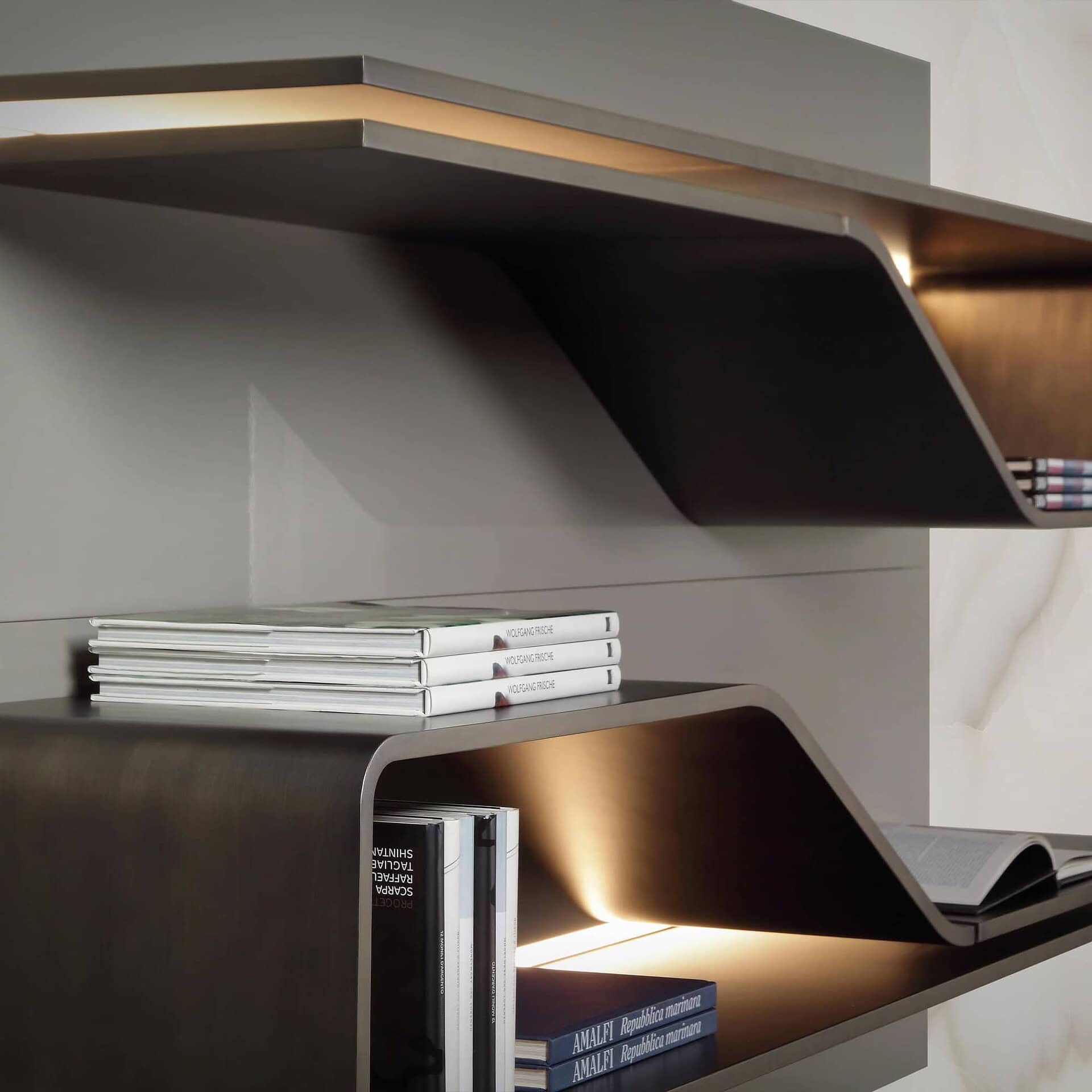 Angled view of Segno Bookcase shelf highlighting its sculptural design and sleek profile.