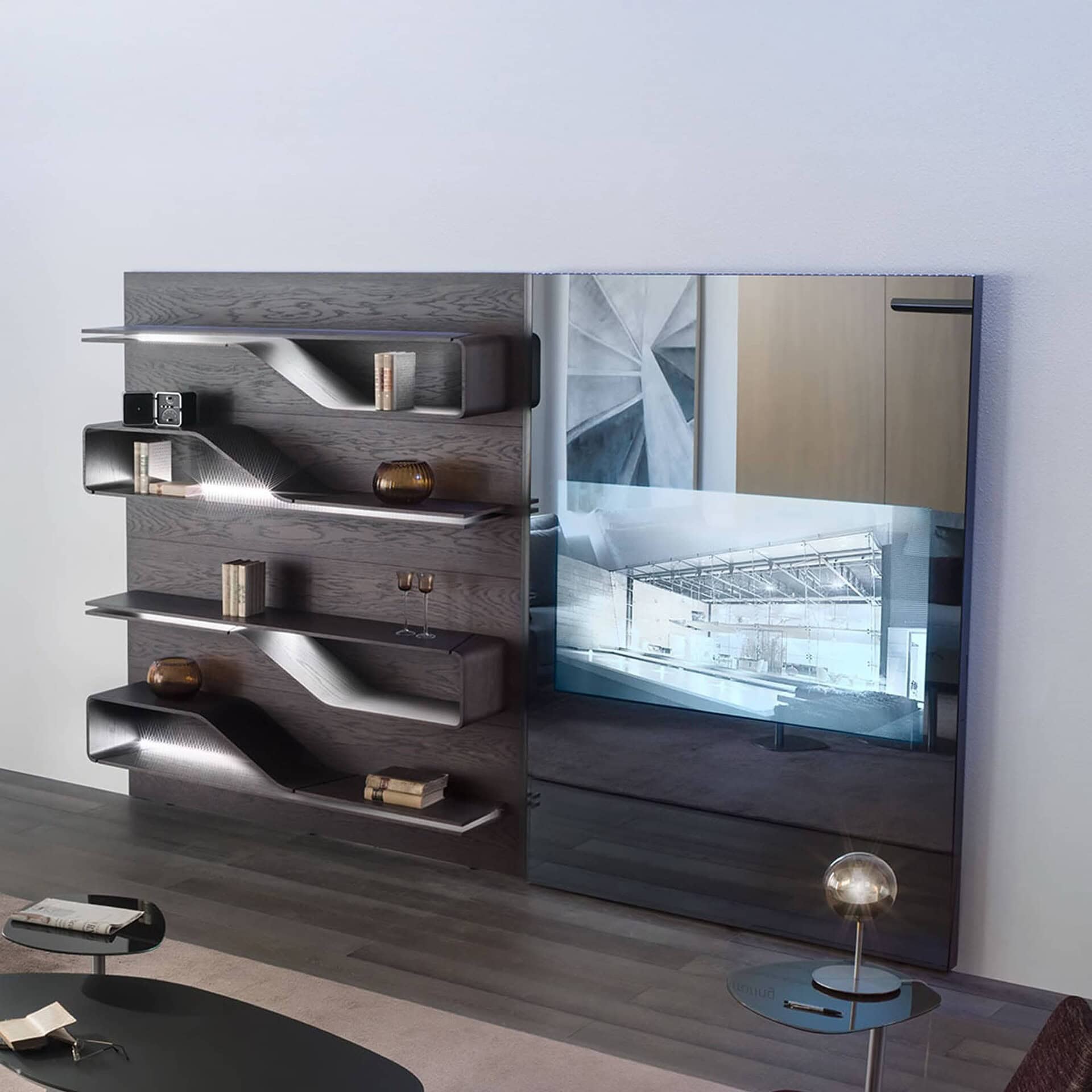 Segno Bookcase with integrated TV panel, demonstrating its use as part of a media wall.