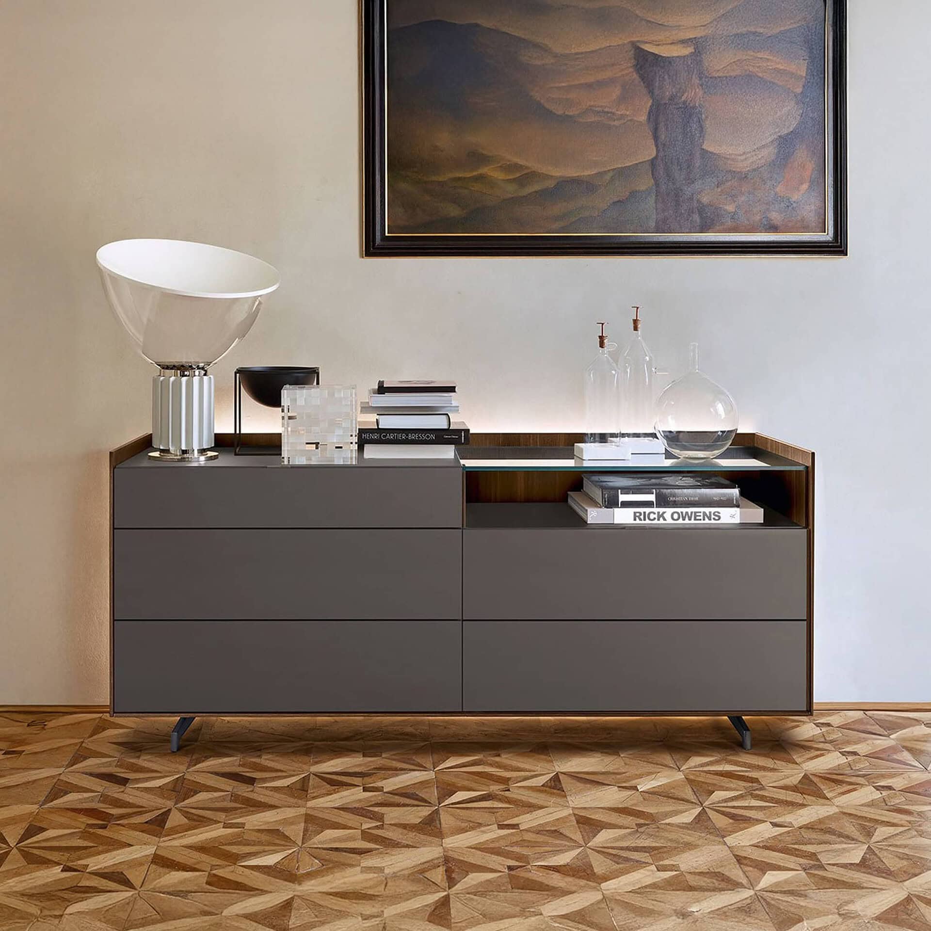 San Giacomo Cabaret Glass Dresser in gray finish with glass top, styled in a modern bedroom interior