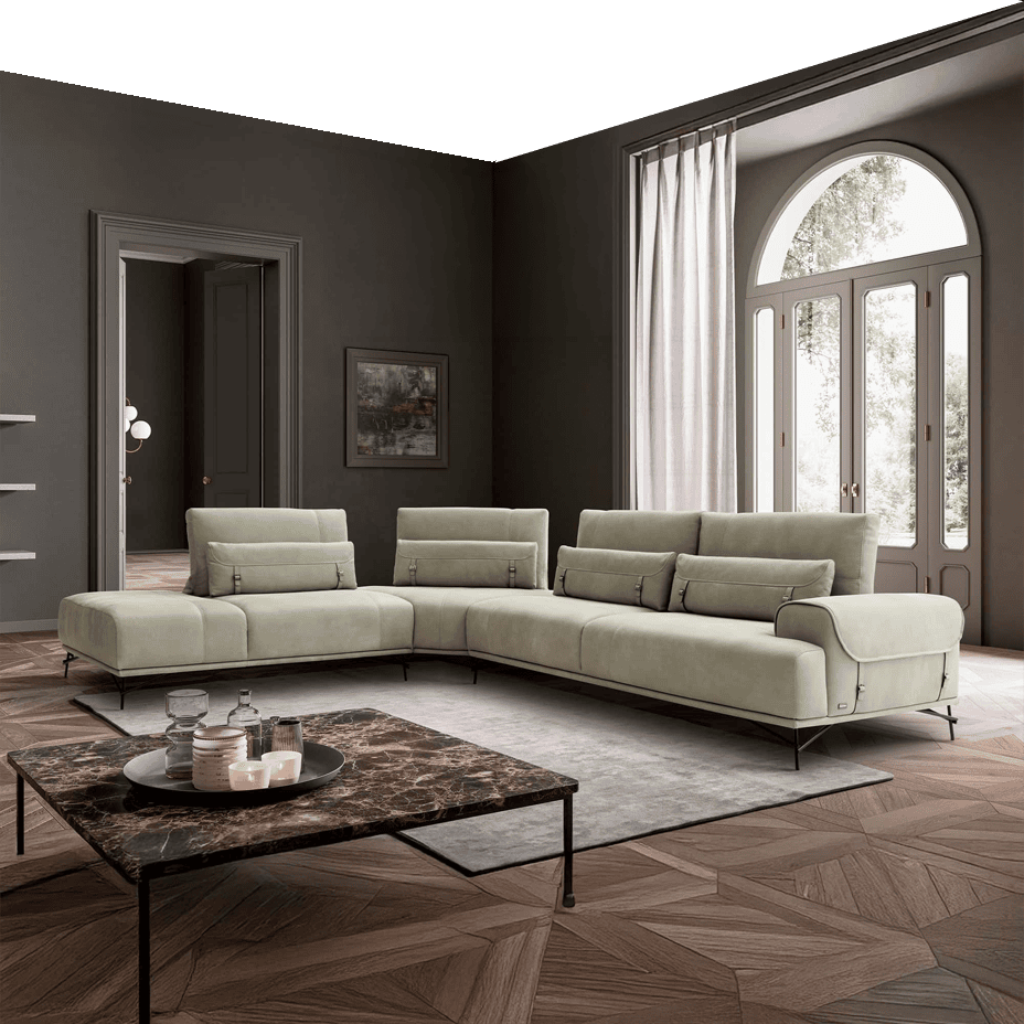 Elegant cream sectional sofa in a stylish living room with large arched window.