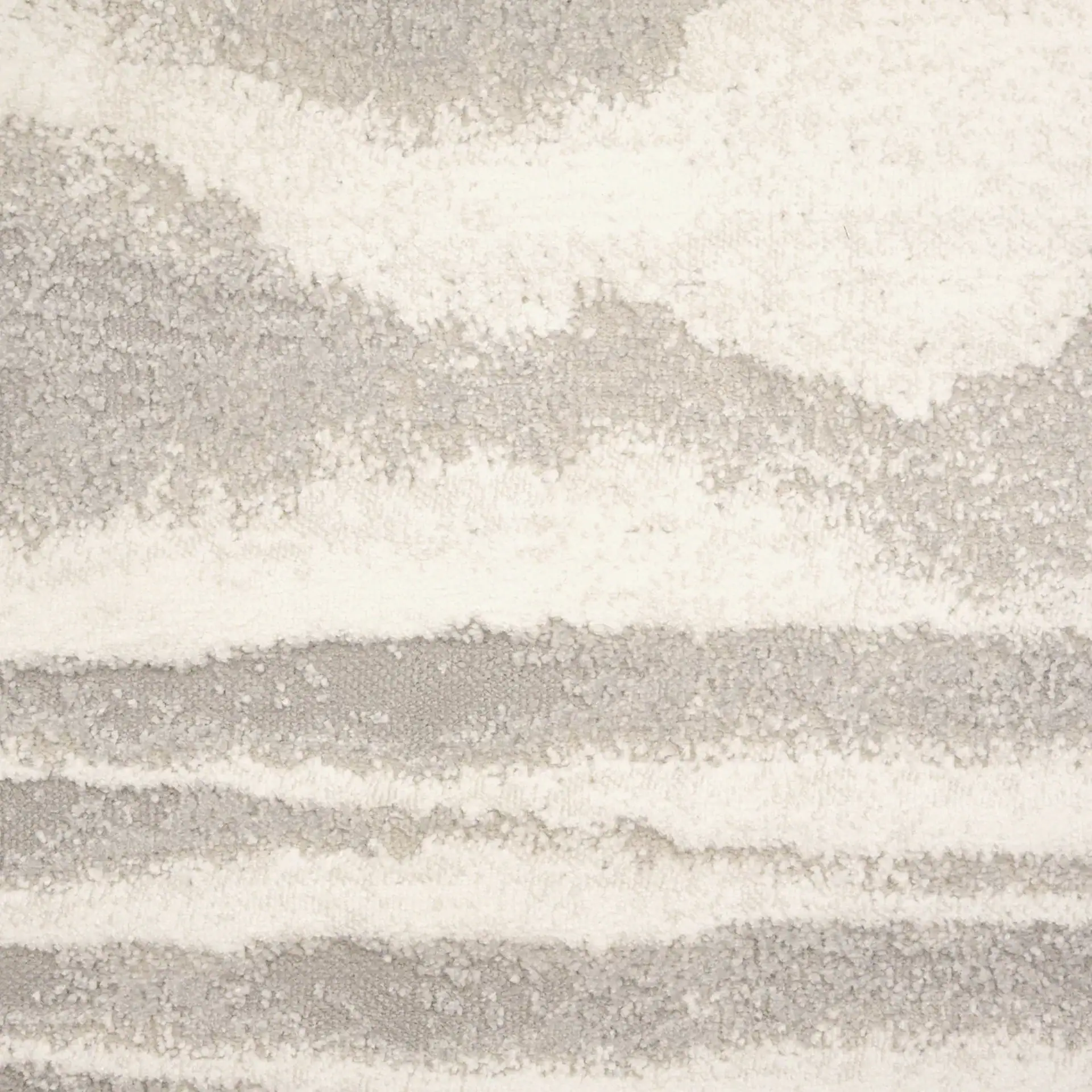 Contemporary abstract rug with neutral tones and textured pattern for stylish home decor.