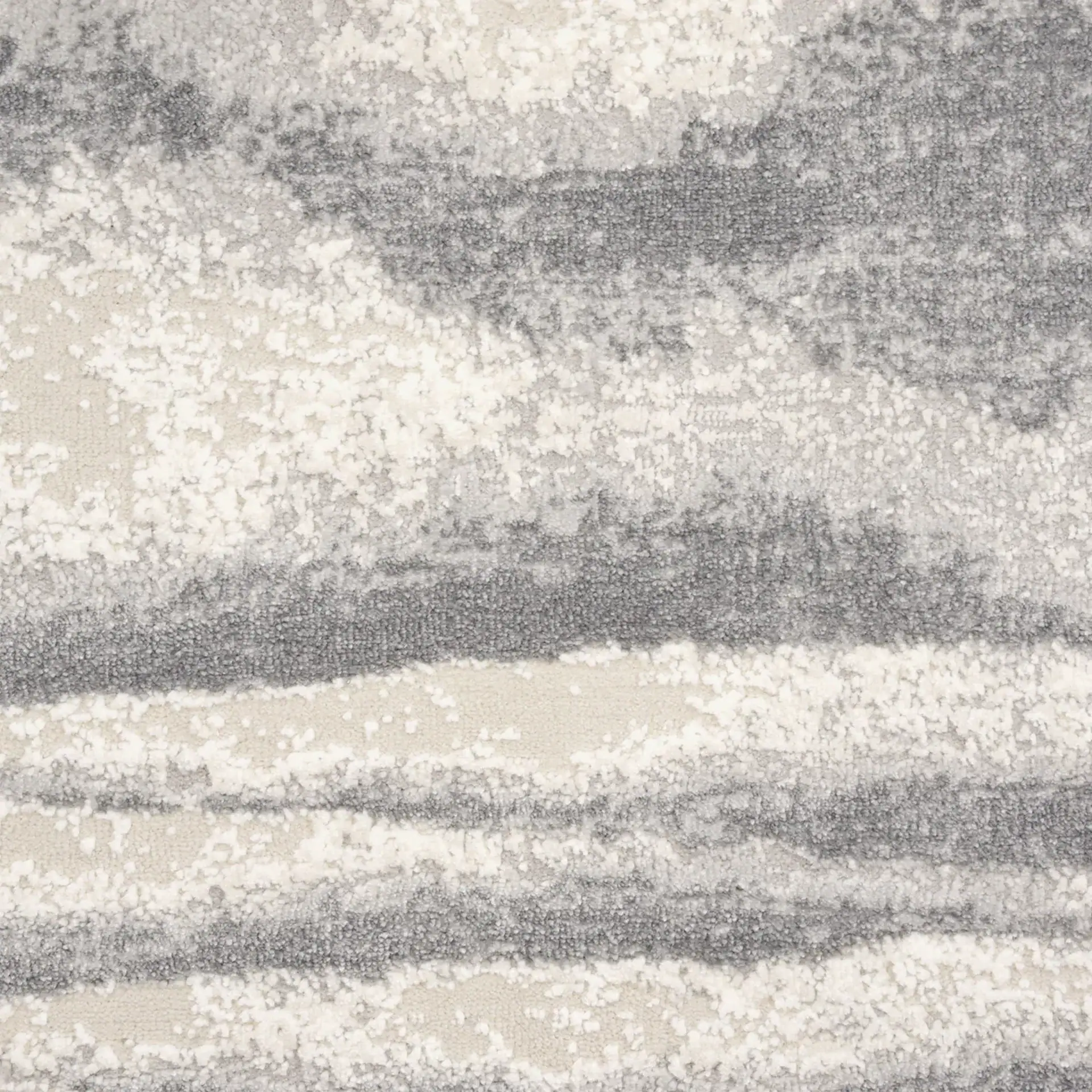 Contemporary gray and white area rug with textured pattern for living room decor.