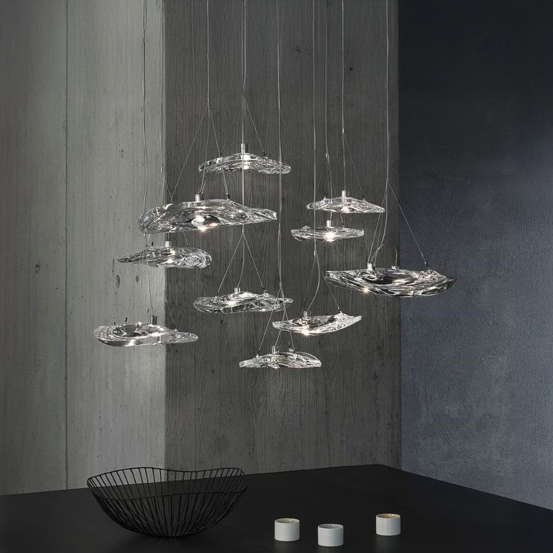 Terzani Manta Crystal Pendant Light arranged in a cascading cluster, showcasing shimmering crystal reflections.