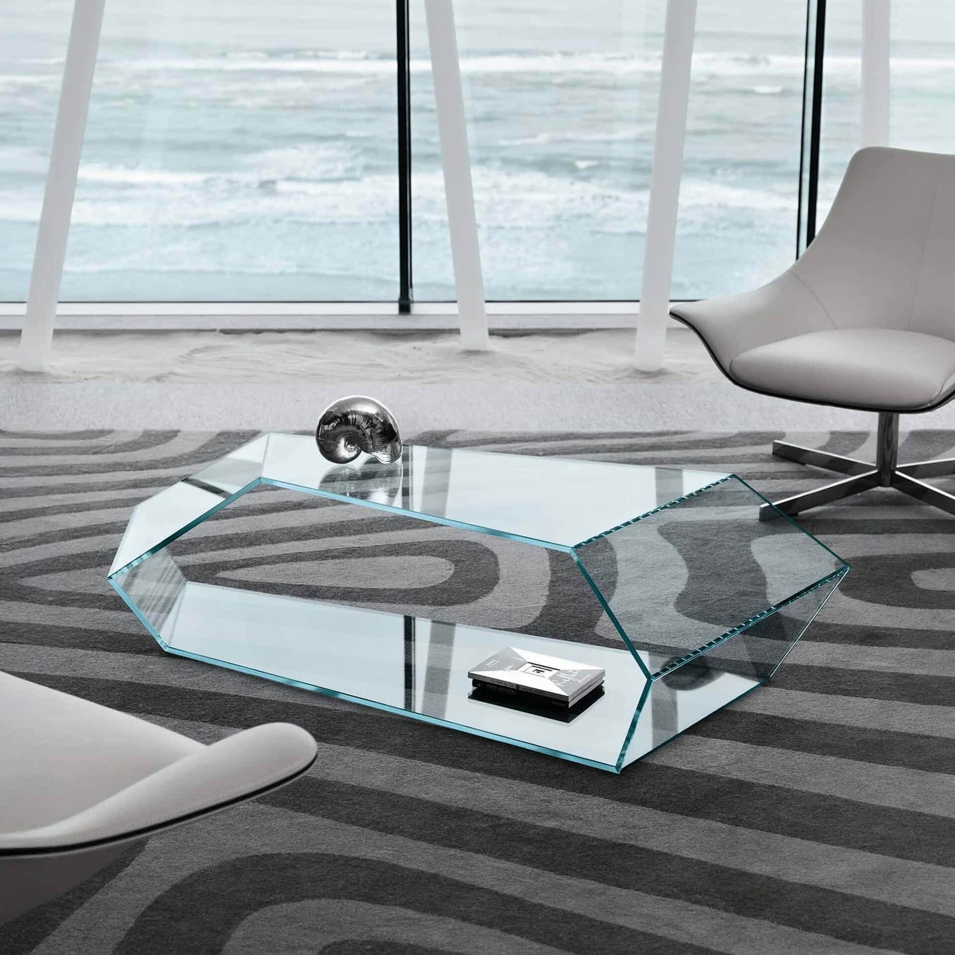 Dekon 2 Low Table in a bright modern living room with glass walls and contemporary seating.
