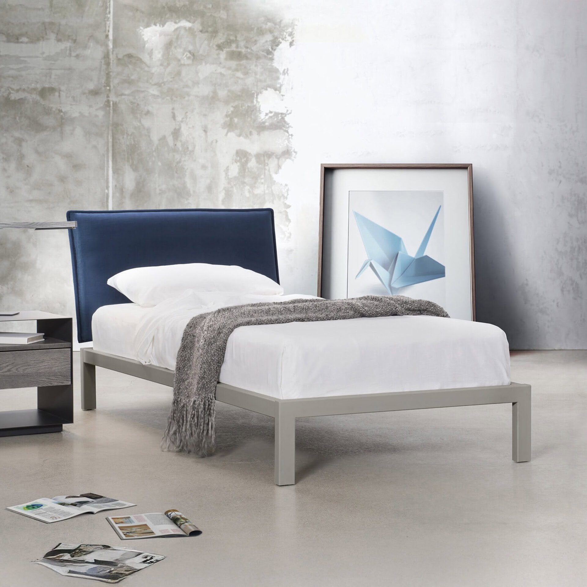 Dream Bed by Trica with blue upholstered headboard and contemporary low profile