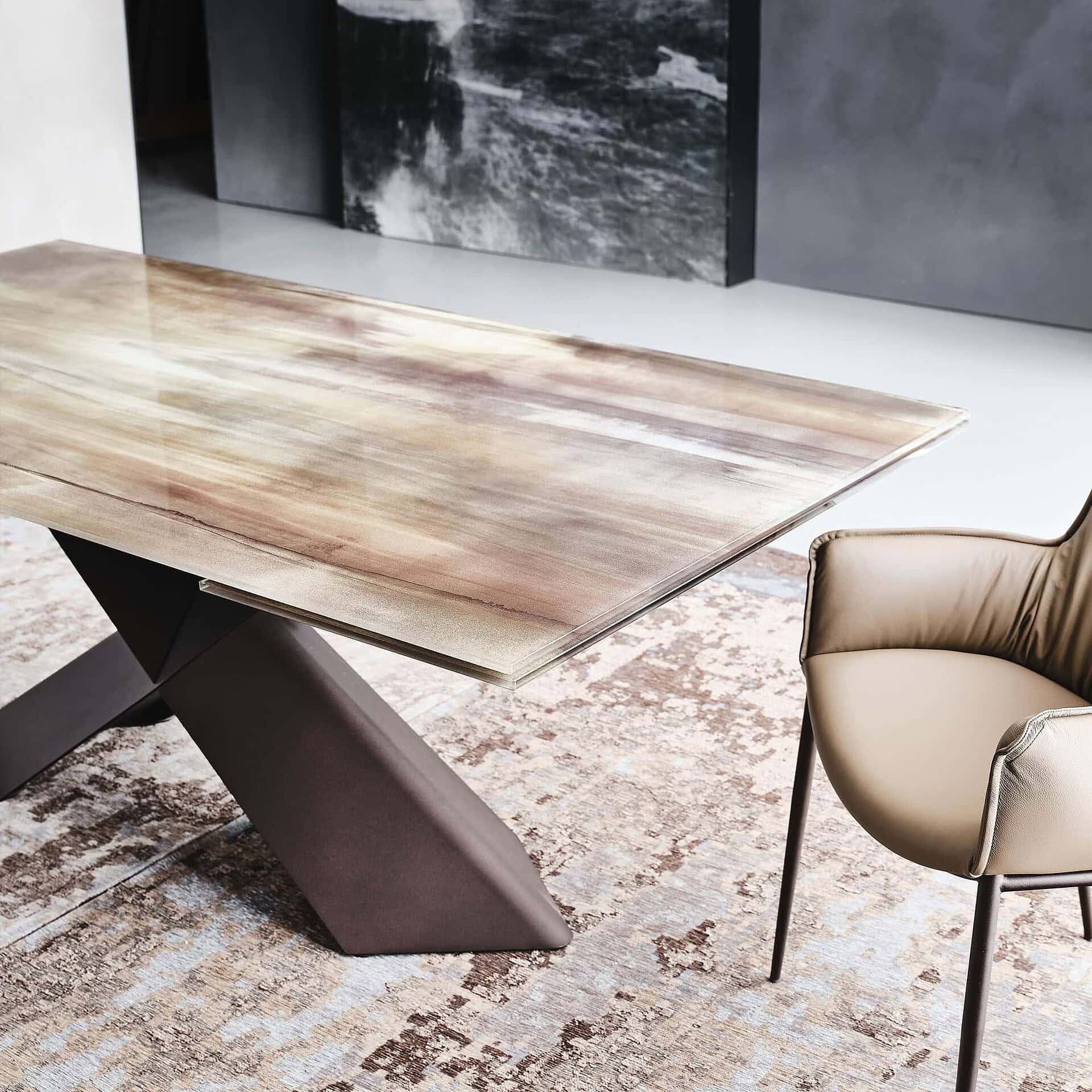 Contemporary dining table with a polished wood finish and modern dark metal base.