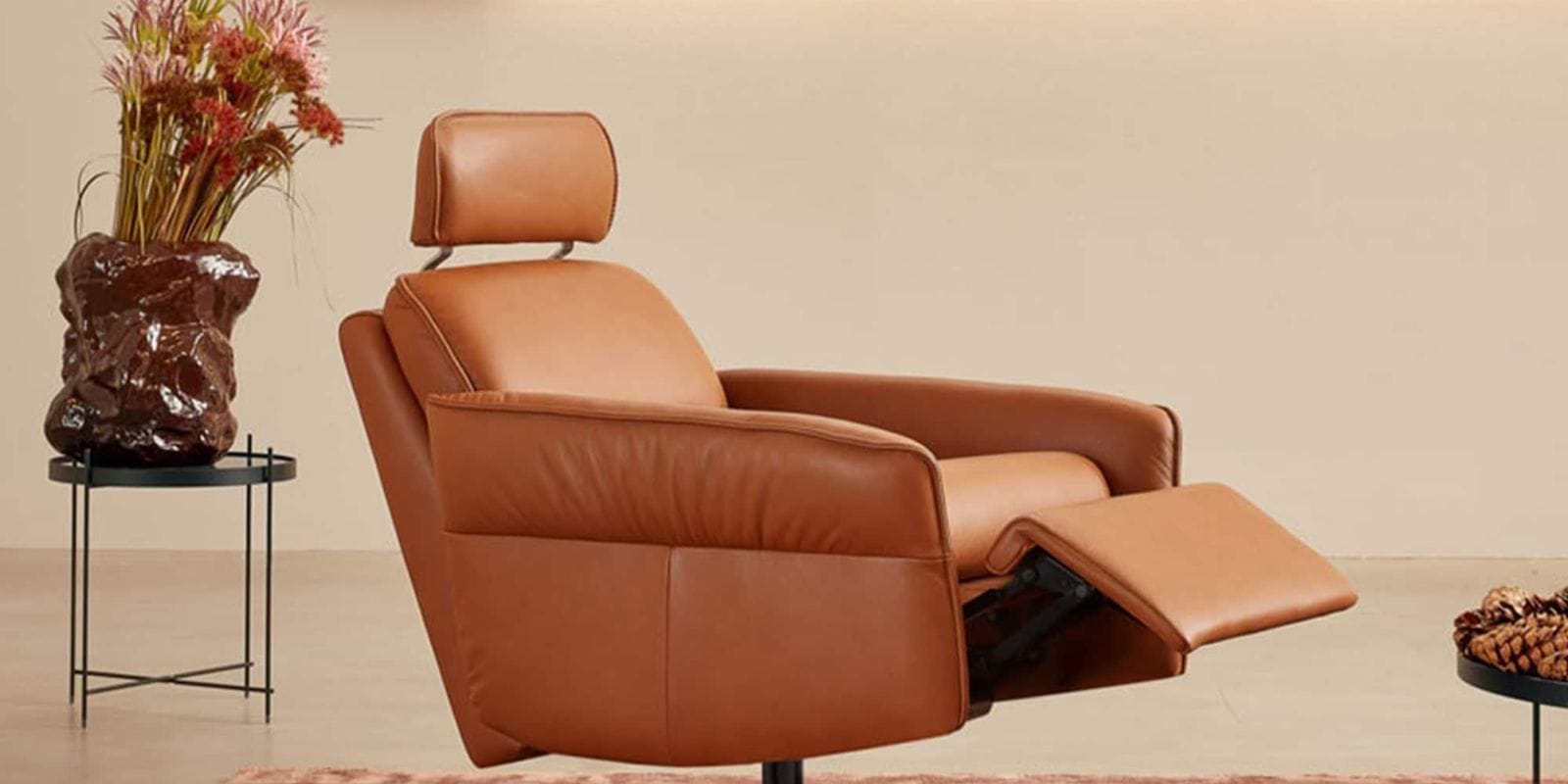 Luxurious tan leather recliner chair with adjustable footrest, modern design, perfect for elegant living room decor. The Aura 8536 Recliner Chair