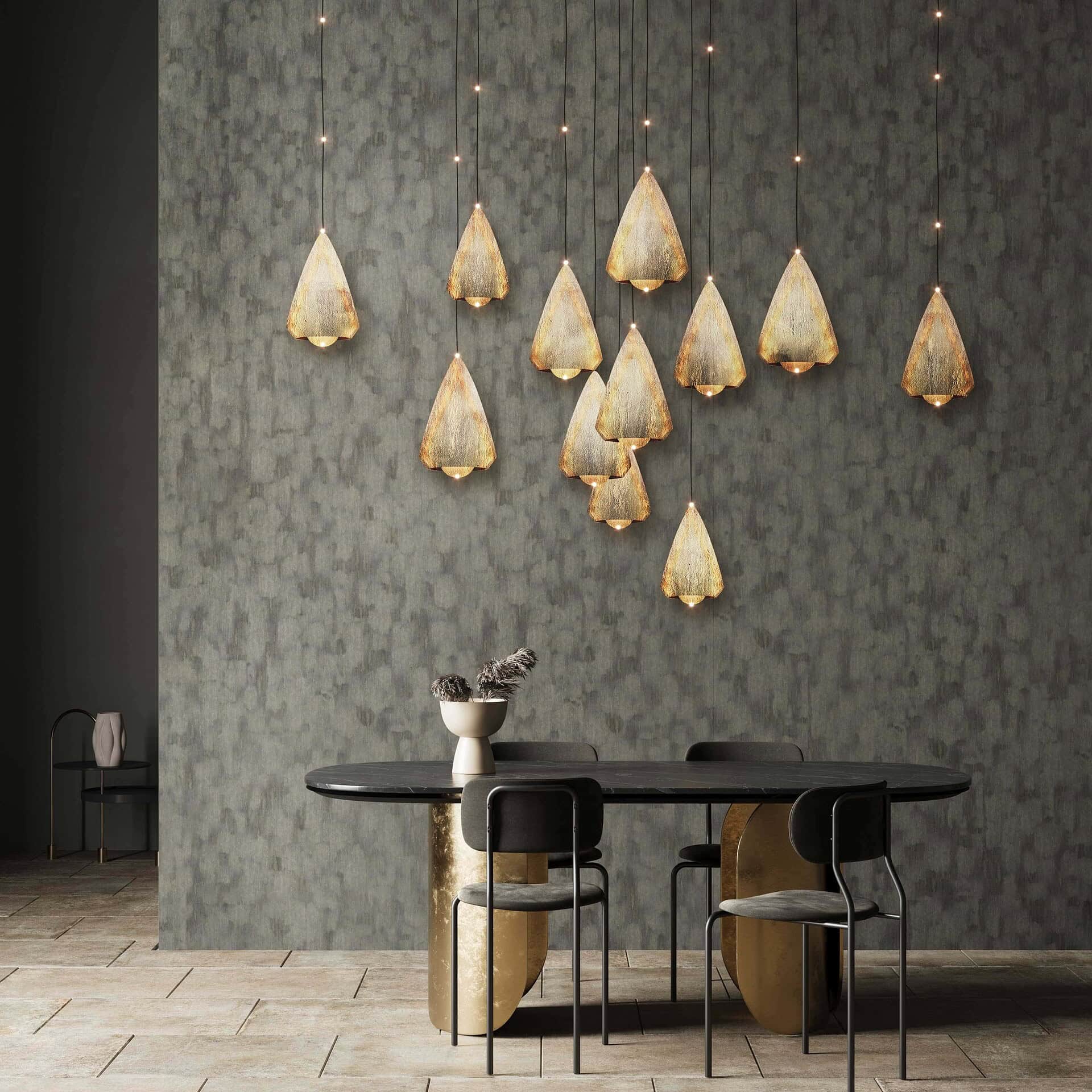 Stylish modern dining room with unique pendant lighting and sleek black table.