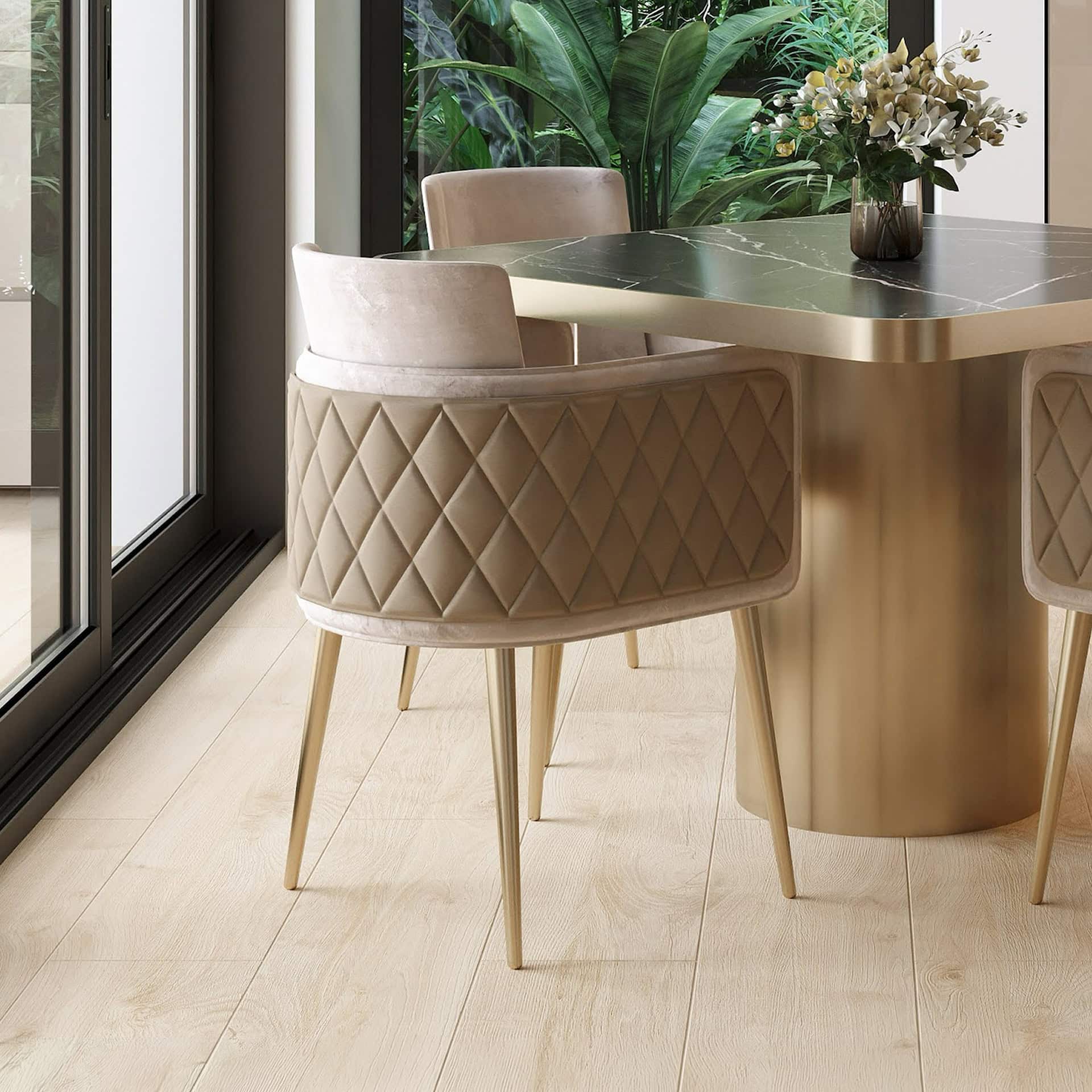 Luxurious beige upholstered dining chair with diamond quilting and wooden legs for elegant home decor.