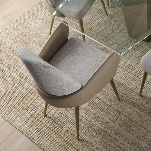 Elegant modern armchair with beige upholstery and wooden legs, ideal for stylish living spaces.