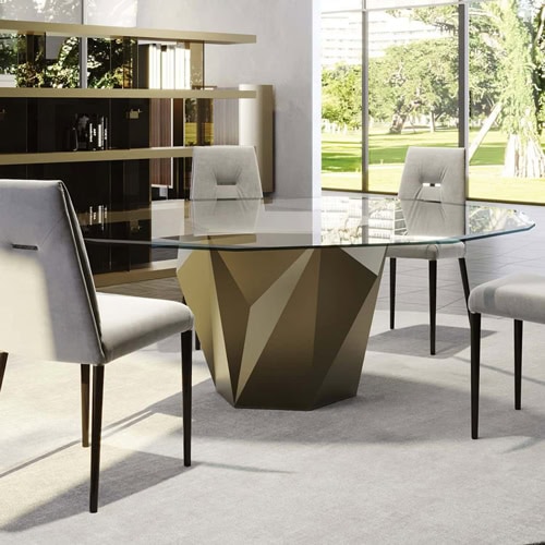 Glass dining table with a geometric base in a modern, bright, and stylish interior.