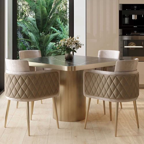 Luxurious beige upholstered dining chairs with diamond quilted design at Sklar Furnishings.
