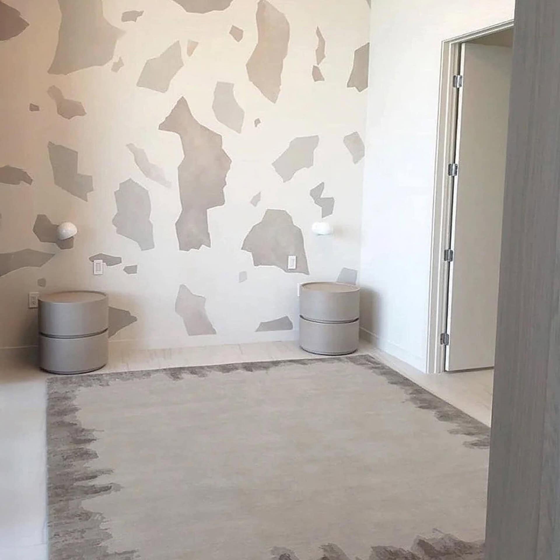 Modern minimalist bedroom with neutral tones and contemporary decor by Sklar Furnishings.