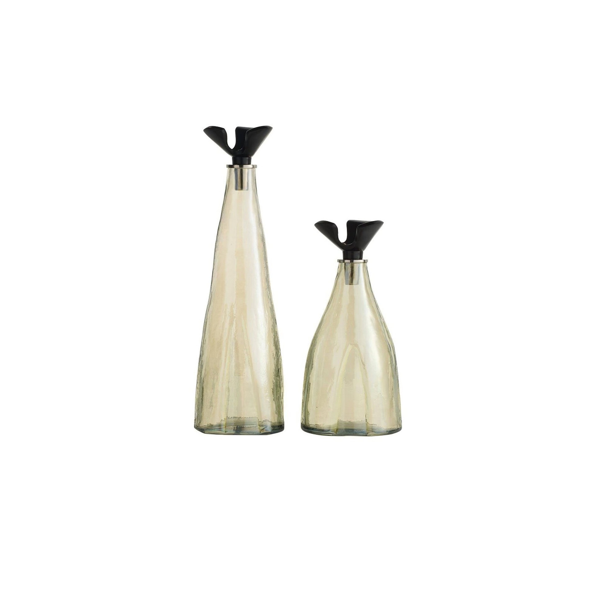 Elegant glass vases with black flower-shaped accents for modern home decor.