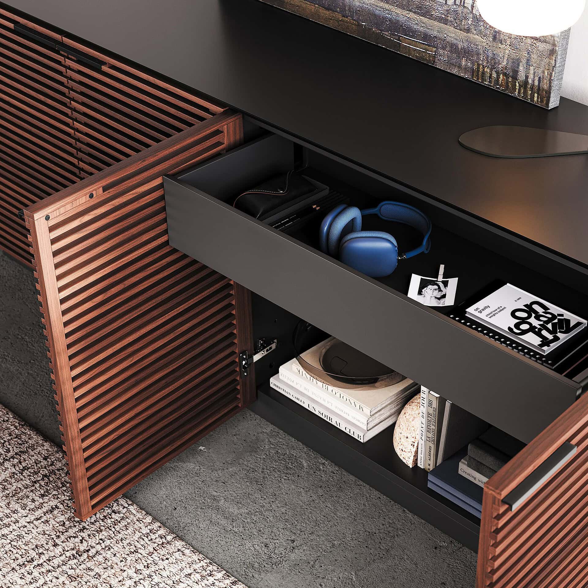 Sleek black and wooden TV console with ample storage for electronics and accessories.