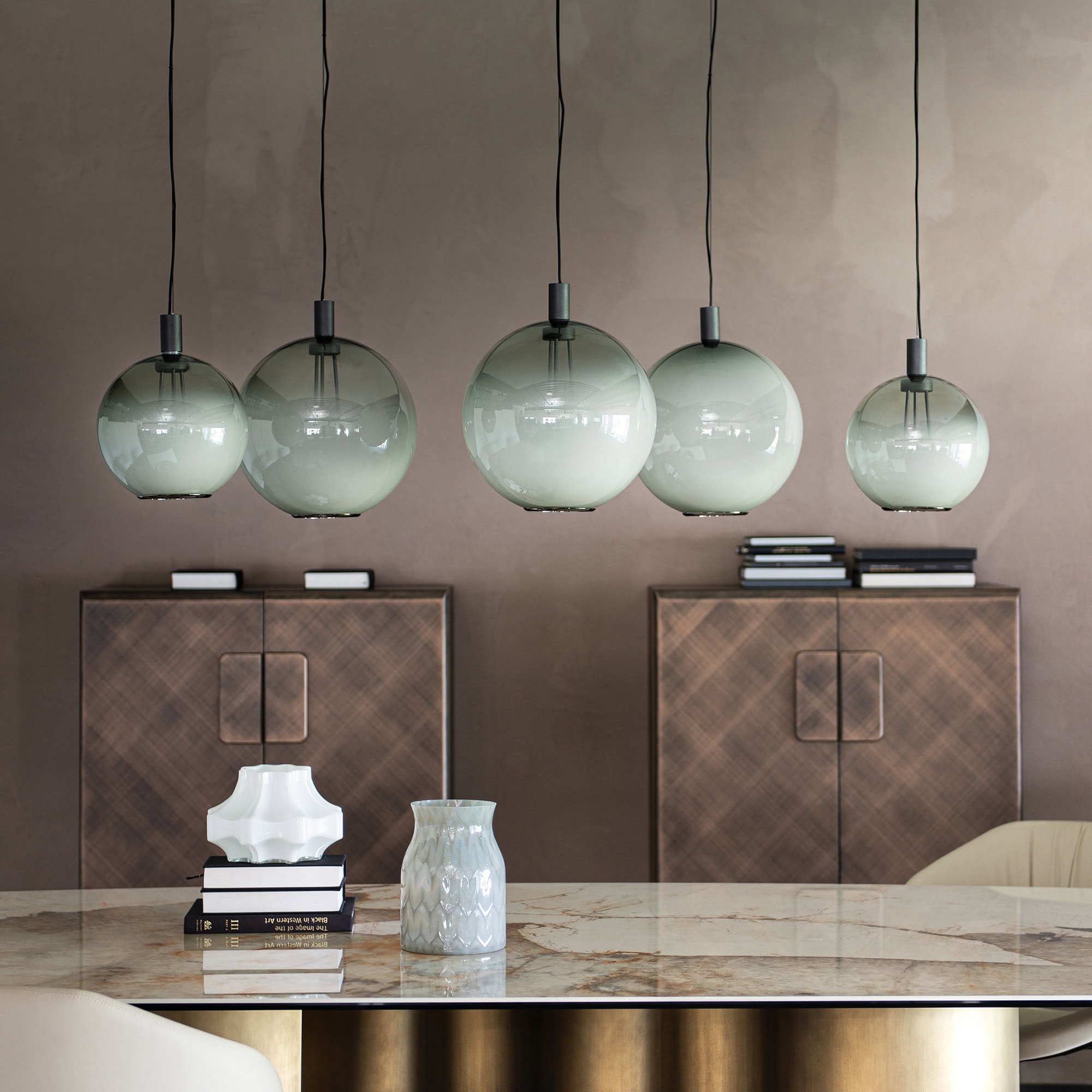 Elegant Modern Pendant Lighting Over Dining Table.