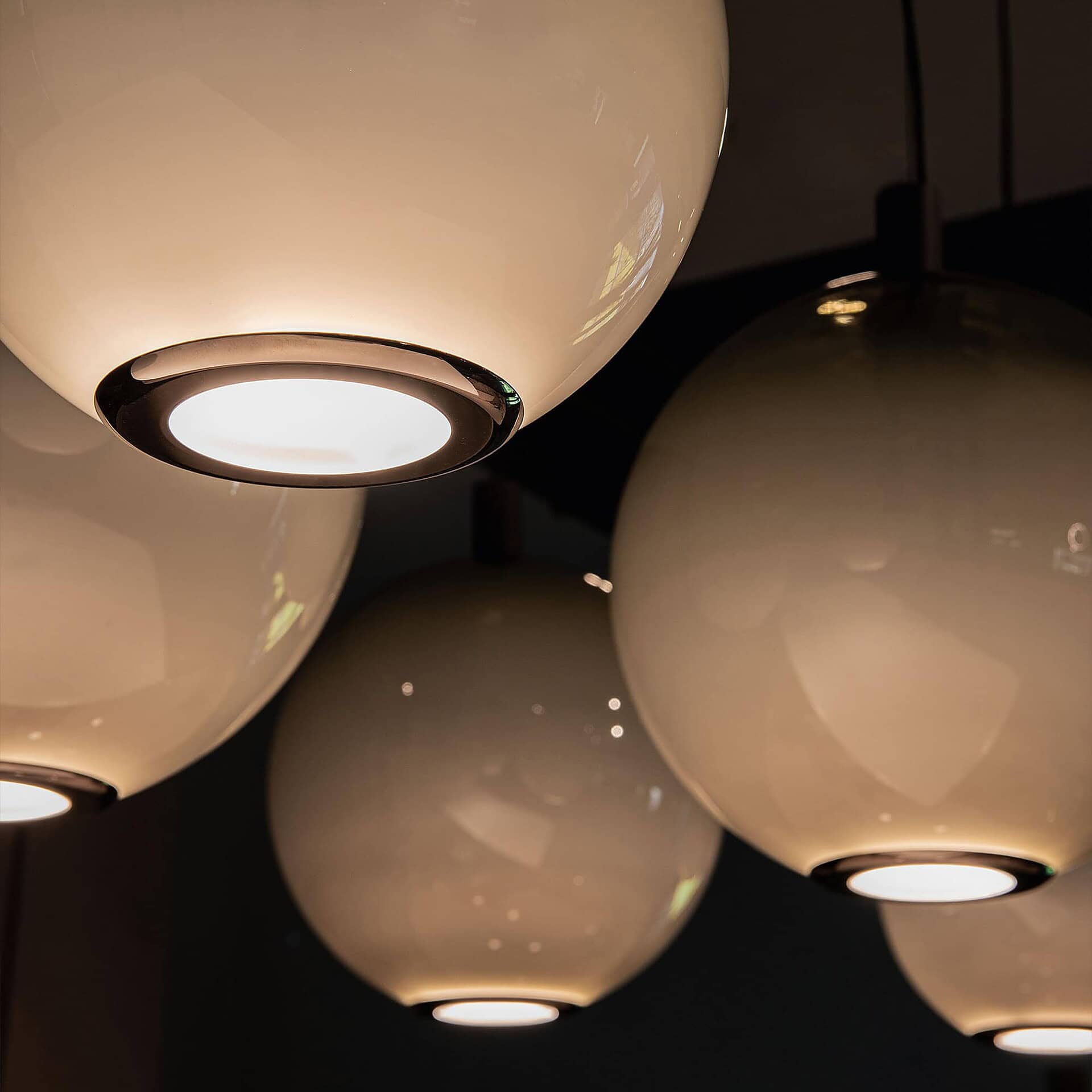 Elegant modern ceiling lights with sleek glass globes and chrome accents, perfect for enhancing contemporary interiors.