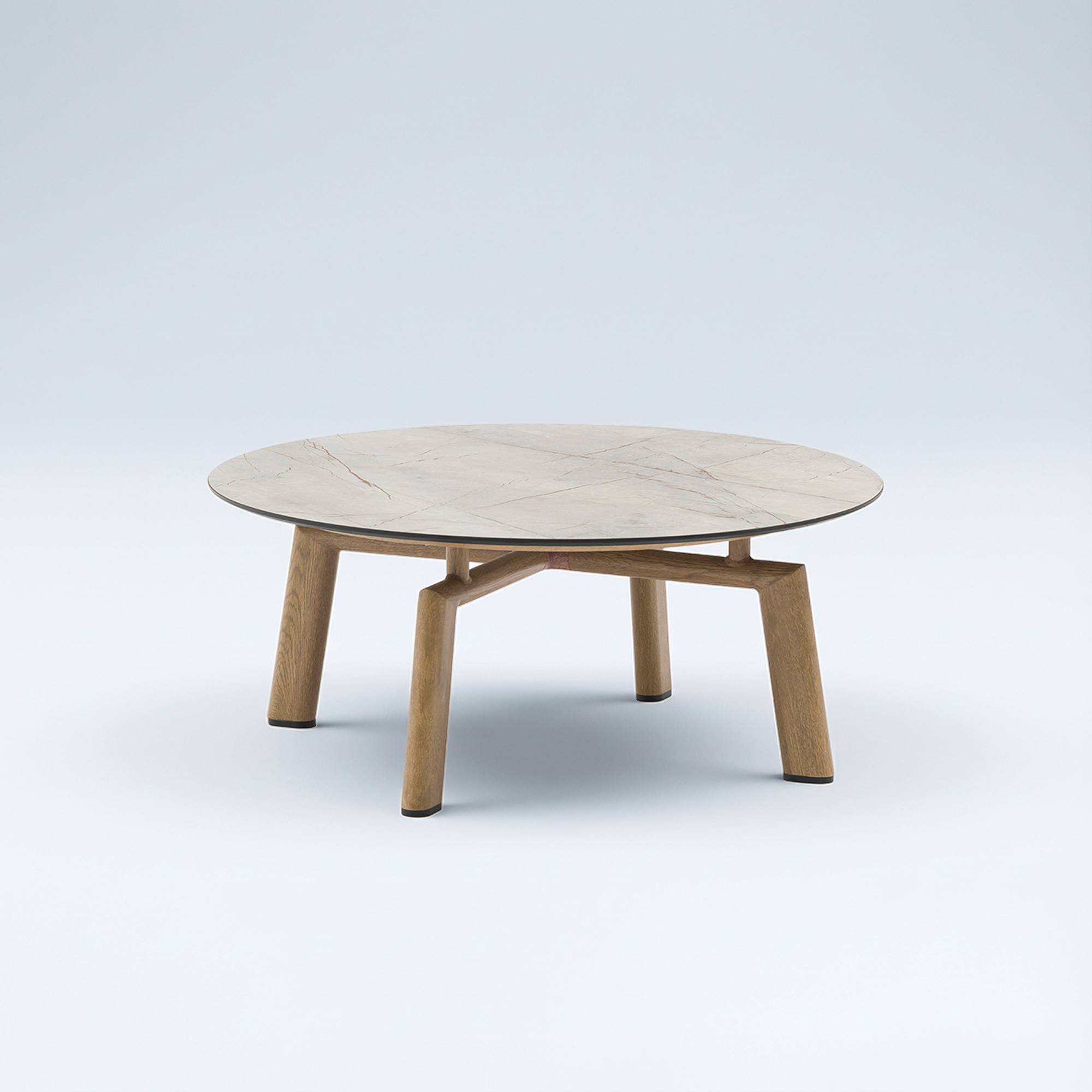 A round coffee table with a light marble-patterned top and a light wooden base with four angled legs, set against a plain light background.