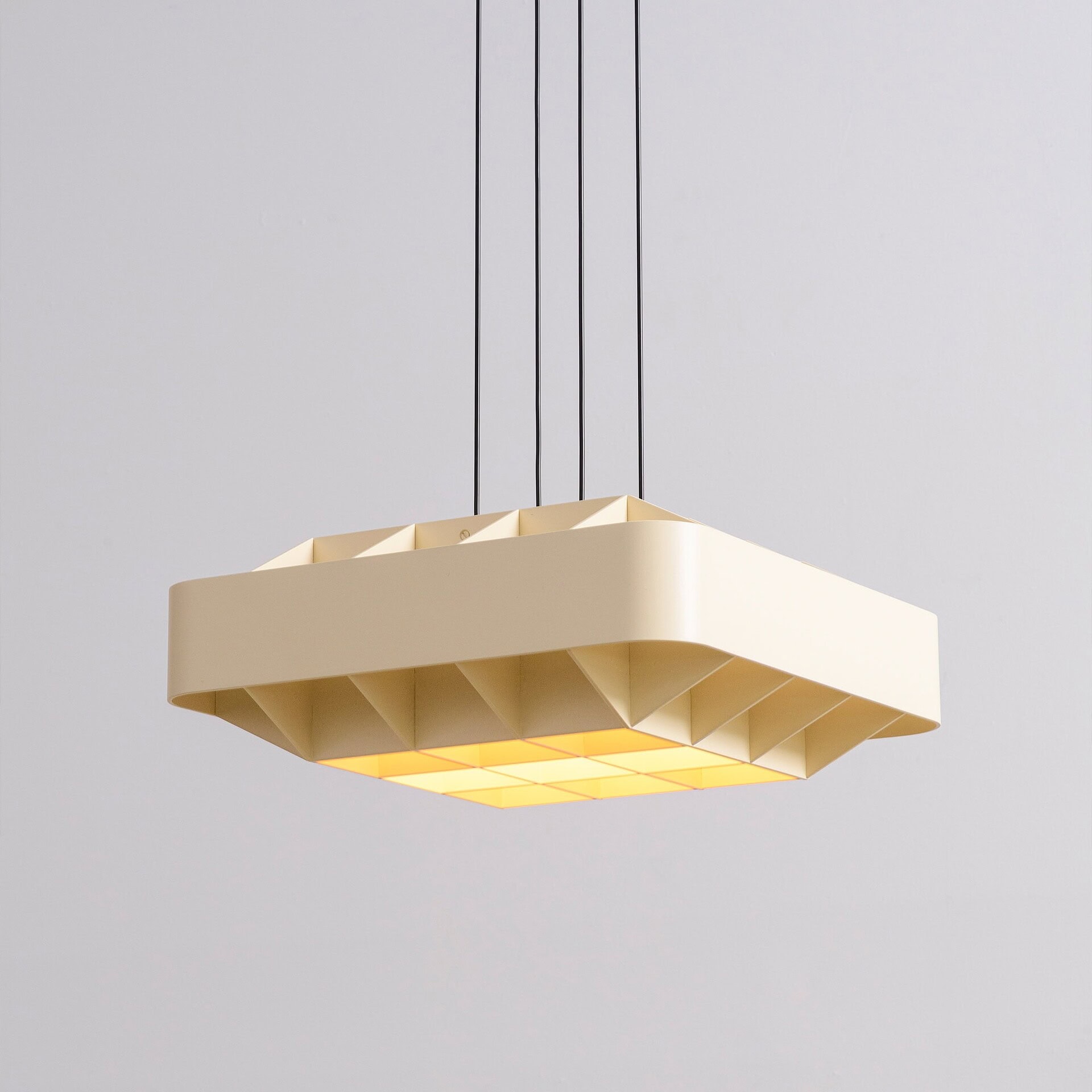 Contemporary beige pendant light fixture for modern interior lighting design.