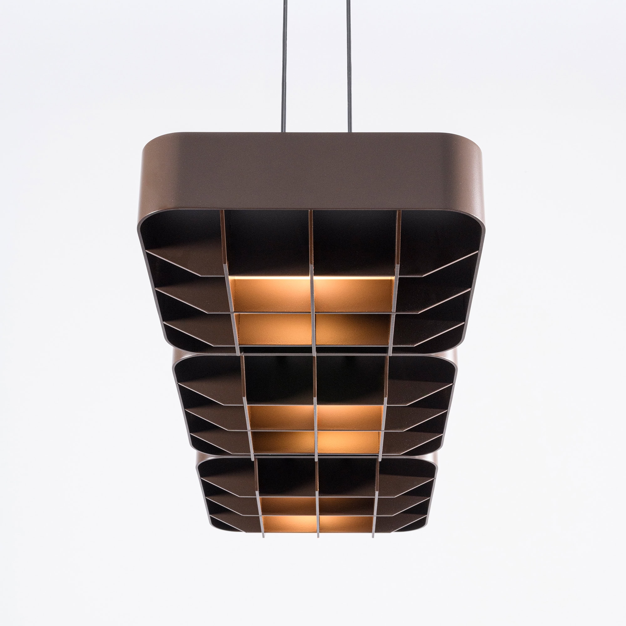 Modern chandelier with geometric design and warm lighting for upscale interiors.