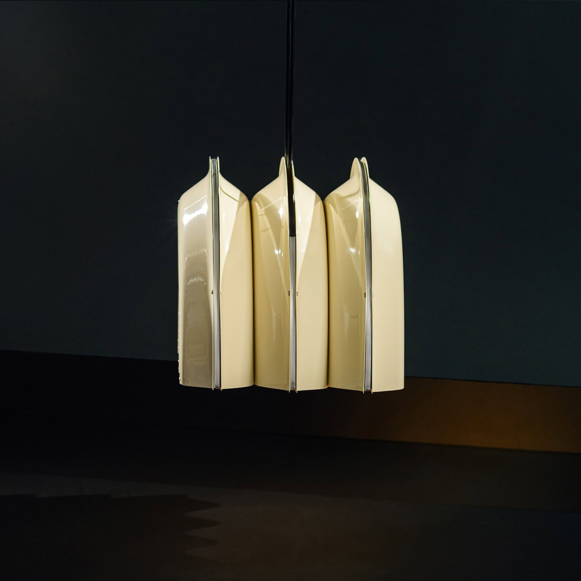 Contemporary hanging chandelier with cream and chrome finish for modern homes.