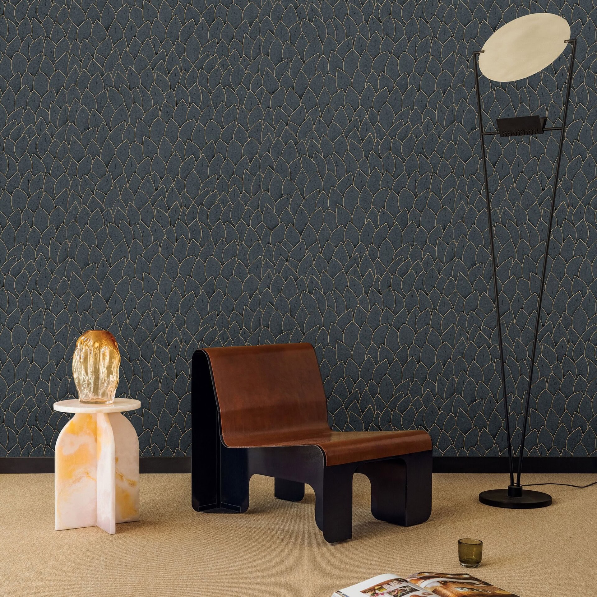 Armchair with black base and brown leather seat, modern living room furniture.