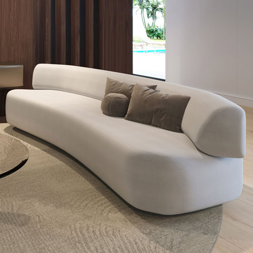 1. Modern curved white sofa with beige pillows for contemporary living room decor.
