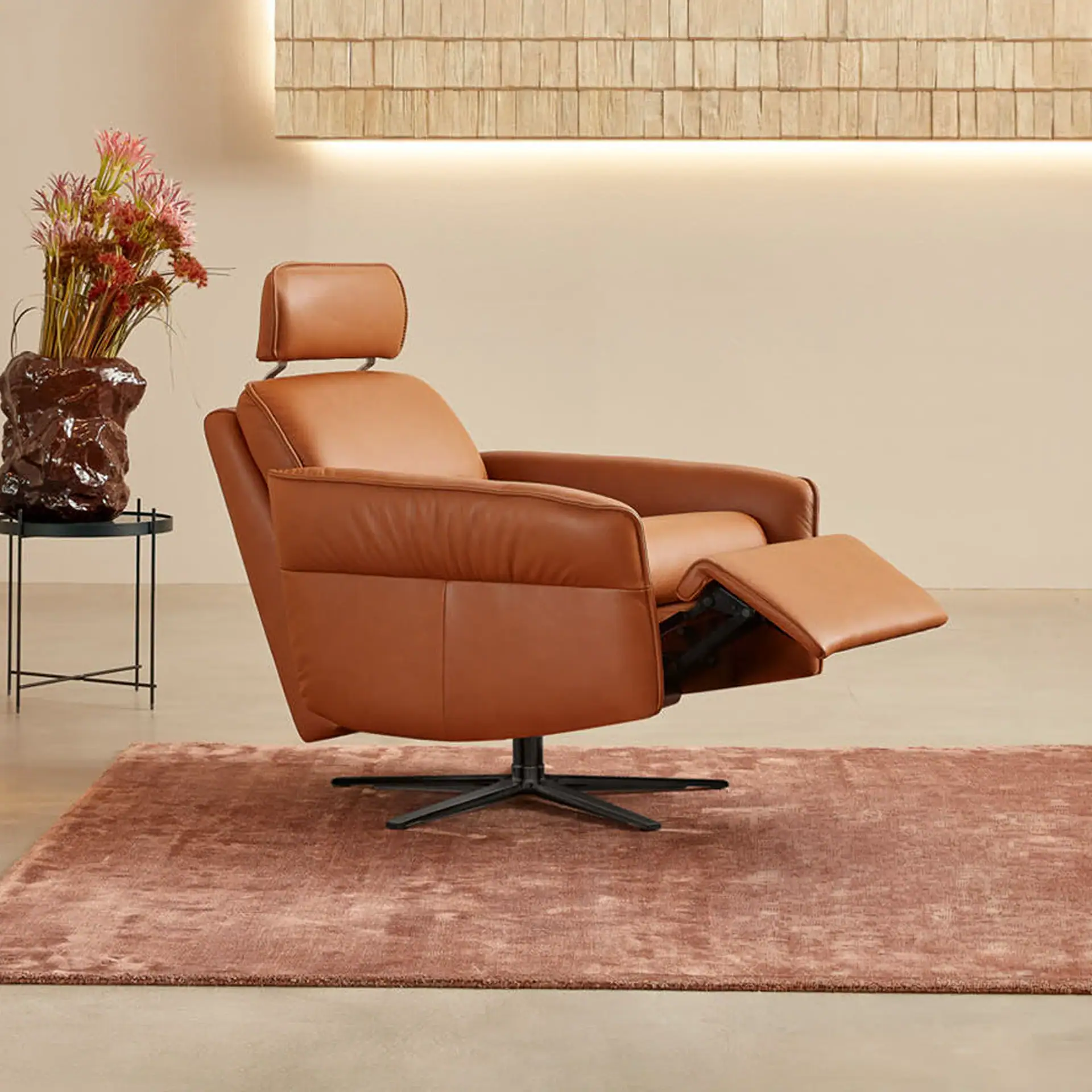 Aura Swivel Recliner Chair in a modern living room setting.